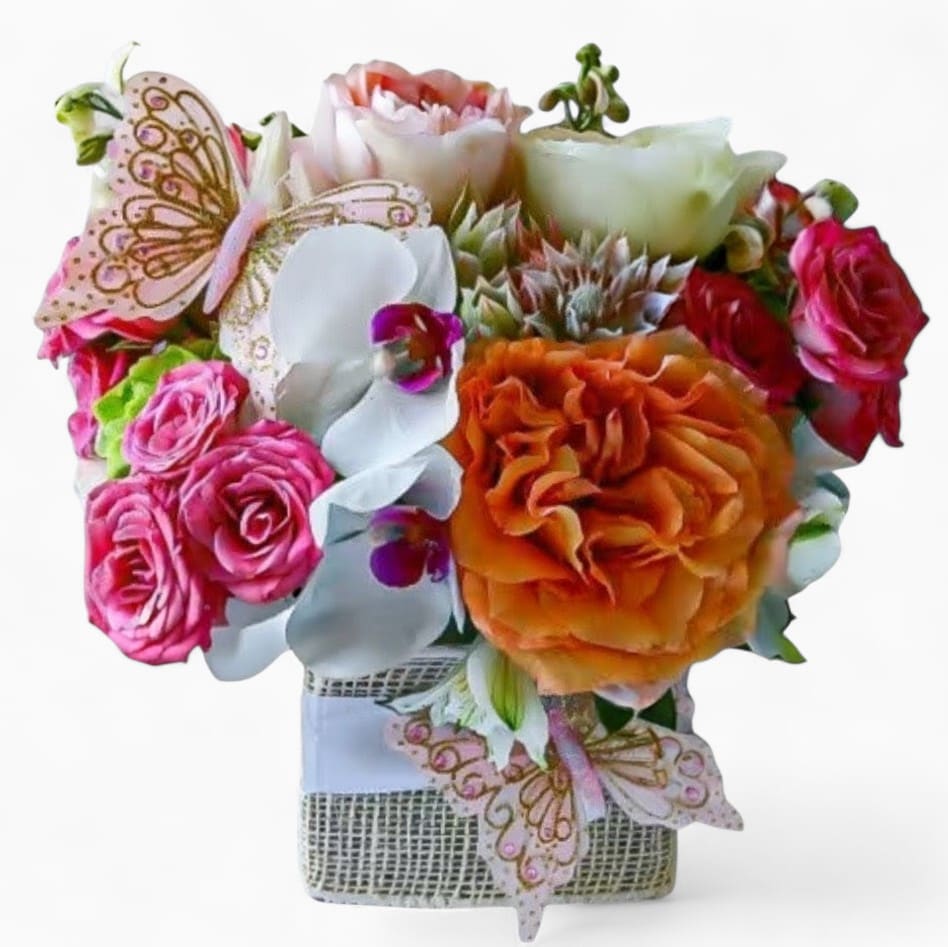 Beautiful Bouquet Designer's Choice - Send this beautiful bouquet today to make them smile with it's lovely mix of colorful pastel blossoms of the day roses orchids hydrangeas and more arranged in a modern glass cube vase wrapped in white jute ribbon adorned with two sparkly cheerful butterflies. Simply lovely and perfect to send today for every occasion. Always made extra special and unique each time. Send them happiness today.