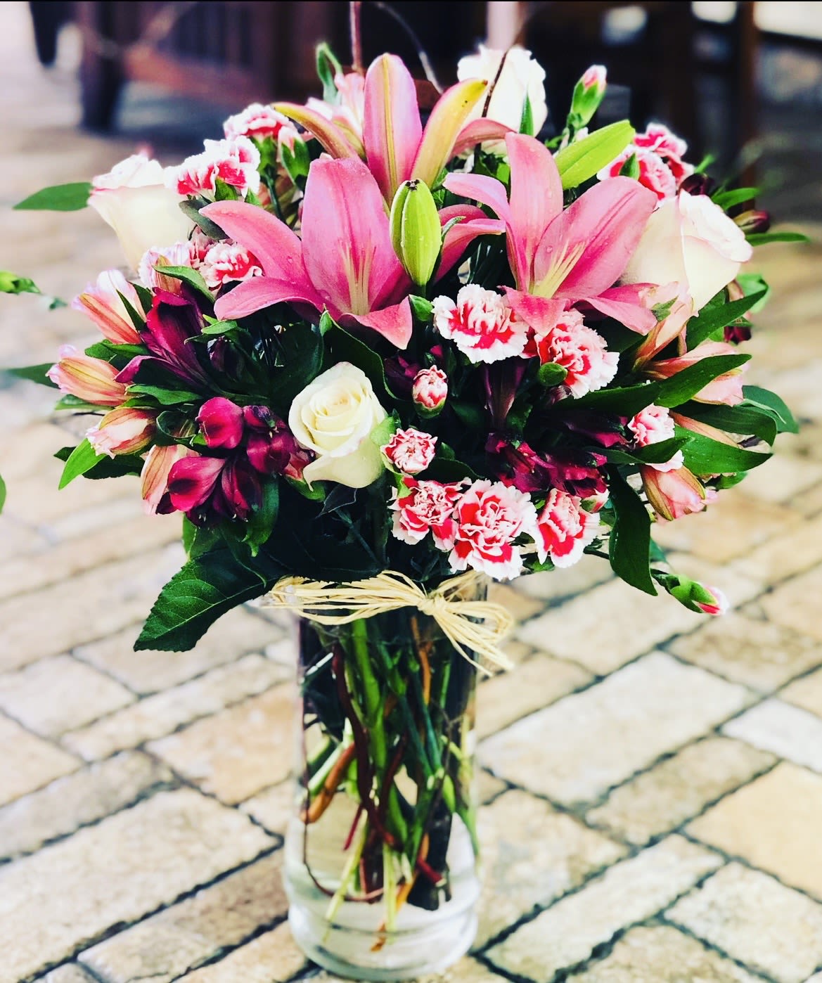 Sweetheart Symphony  - Sweetheart Symphony is a charming medley of love and color, designed to delight the senses. This enchanting bouquet features a harmonious blend of roses, seasonal blooms, and delicate accents in romantic reds, soft pinks, and pastel hues. Each flower is carefully arranged to create a balanced, vibrant composition that sings with elegance and affection. Perfect for Valentine’s Day or any special moment, it’s a beautiful way to say you make my heart sing. 