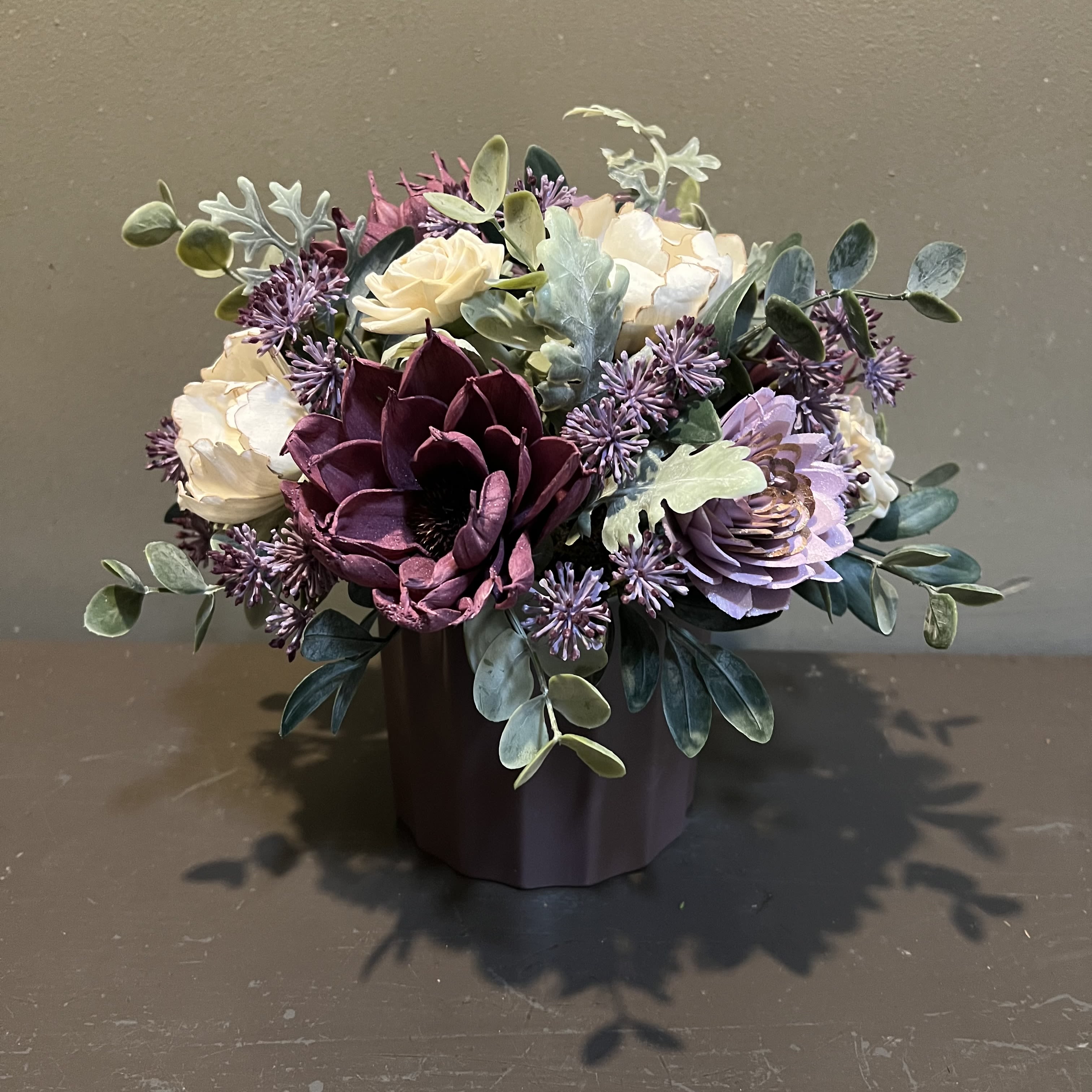 Sola Wooden Flower Centerpiece - Plum Lovin' - Hand-dyed and hand-crafted in Minneapolis, these flowers made of balsa wood are a wonderful everlasting floral arrangement - great for those with allergies! Can be used as a natural essential oil diffuser too!  Arrives in a keepsake vase. Approx. Dimensions: 10"Tx10"W 