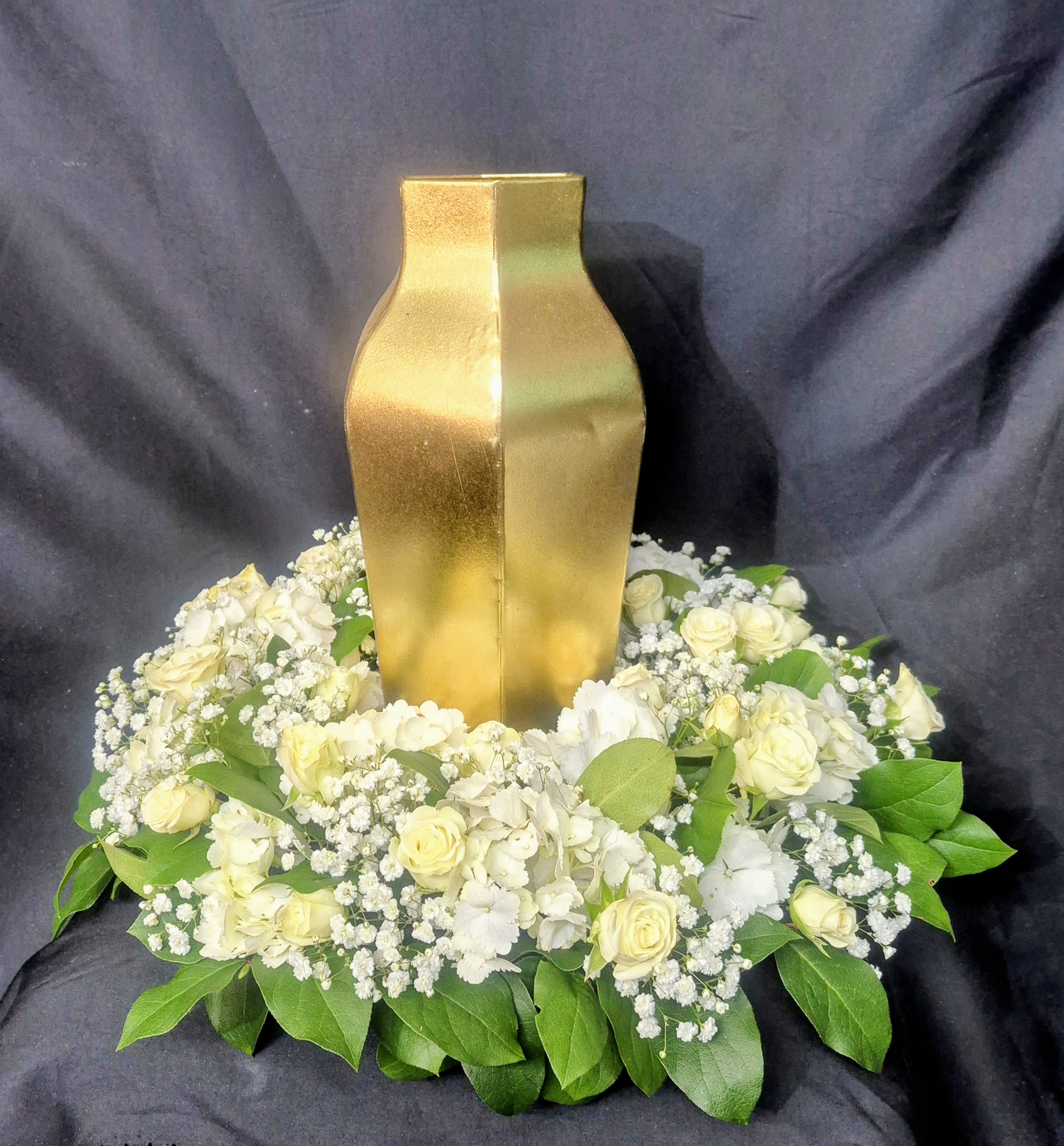 SERENITY MEMORIAL URN WREATH - An elegant 14 inches ring of floral blooms and lush greenery arranged to frame the urn with grace and beauty. This wreath symbolizes peace, love, and everlasting remembrance. To customize flowers and color(s) please call 954-558-2264 
