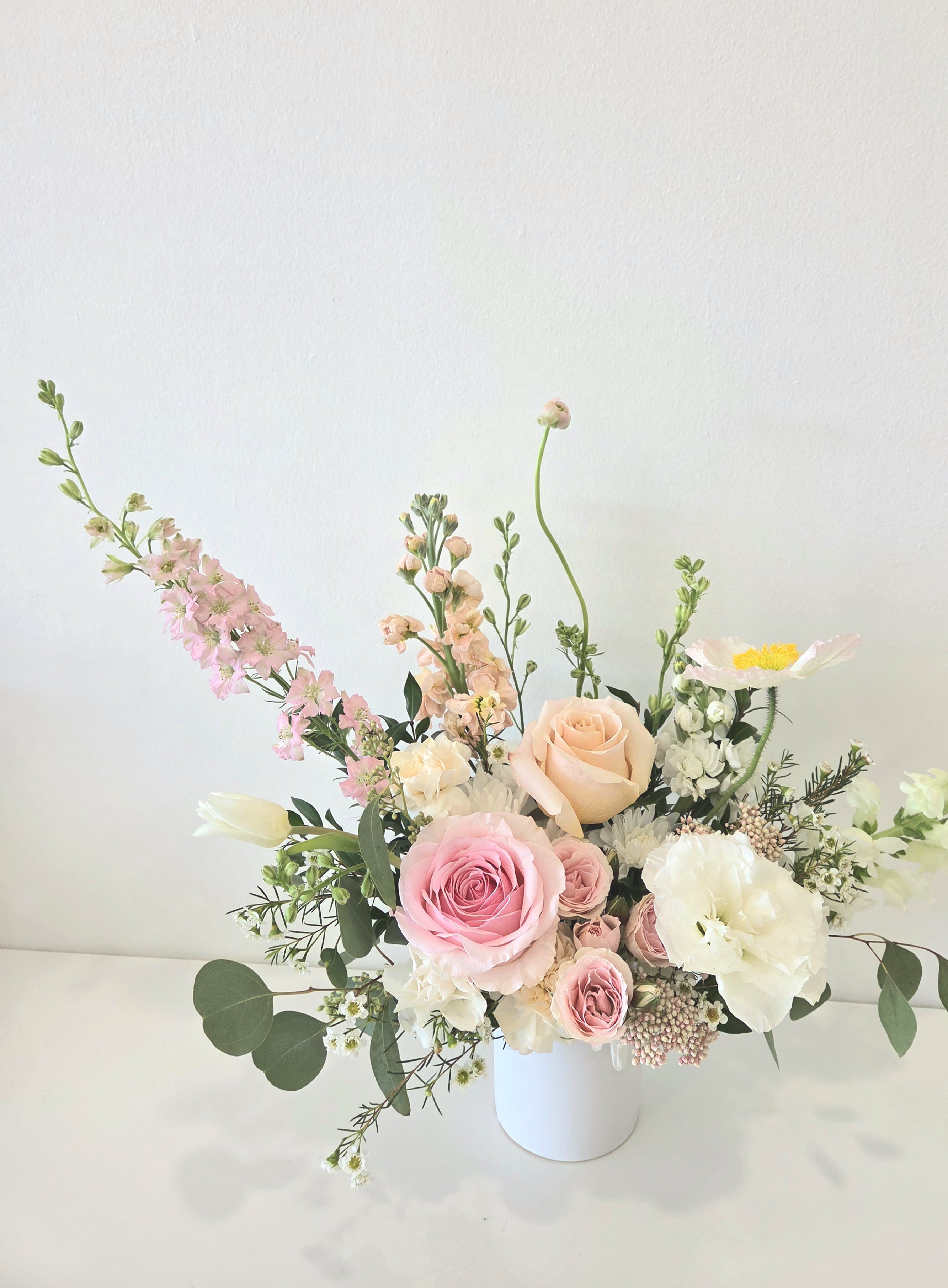 Blooming Moments (S) - Small Size Vase Arrangement  Store Hours Mon–Fri: 9:30 a.m. – 6:00 p.m. Sat: 9:00 a.m. – 4:00 p.m. Sun: Closed  Delivery Deliveries are typically made between 9:00 a.m. and 3:00 p.m. While we are unable to guarantee specific delivery times, we will always do our best to accommodate your requests. If you prefer a later afternoon delivery, please let us know in advance and we will try to accommodate. If your delivery address requires a gate code, please provide it to ensure smooth delivery.  Pick-Up If you need to pick up before 10:00 a.m., please text us directly to place your order. (Text: 714-715-1482) For pick-ups at opening time, we kindly ask that orders be placed by 4:00 p.m. the day before. Please also try to pick up your order at the scheduled time. When pick-ups are delayed during busy time slots, it may affect other customers placing orders for the same time. We appreciate your understanding! Custom &amp; Event Orders For small event or custom flower orders requiring pick-up outside of our regular business hours, please contact us via text in advance to arrange your order.  Please Note Your arrangement may vary slightly from the photos depending on seasonal availability and store stock. However, we will match the overall color palette and ensure your flowers are fresh and beautifully designed.  Thank you!!