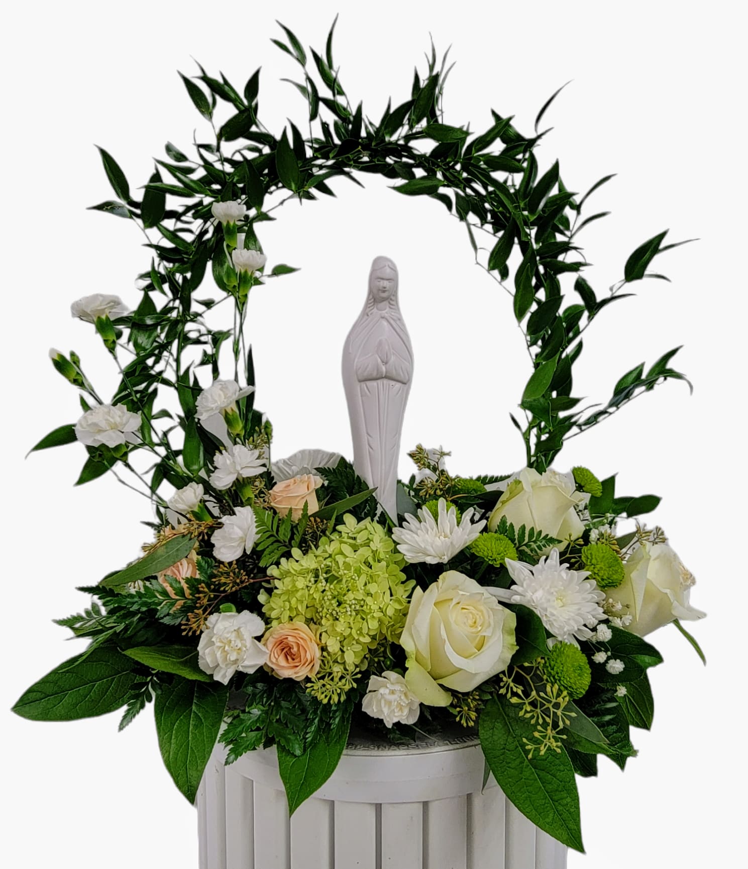 White religious statue framed by an arch of greenery and white flowers in a white container