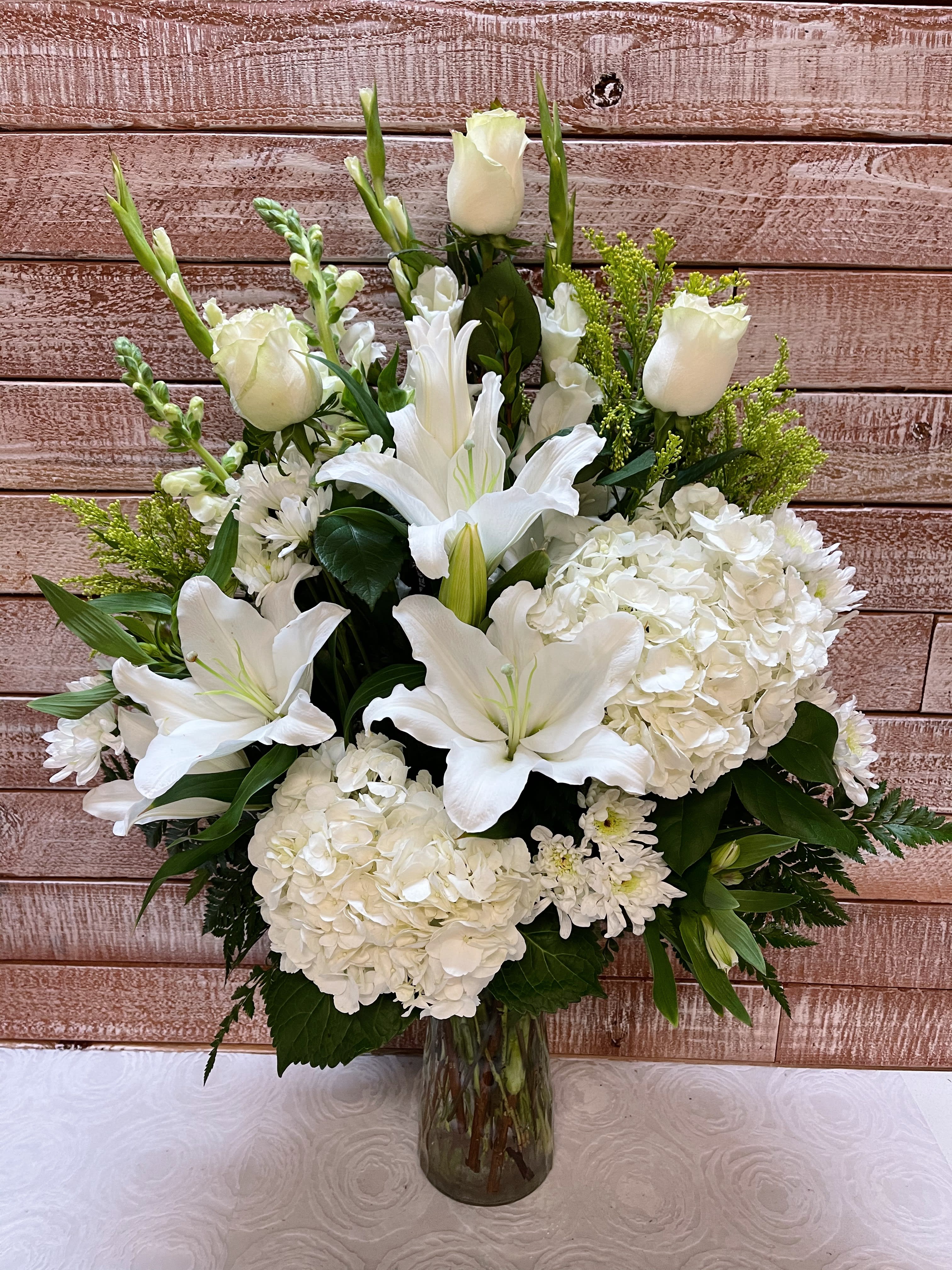 In My Thoughts  - This lovely vase holds a mixture of flowers that will surely bring happiness to ones day. 