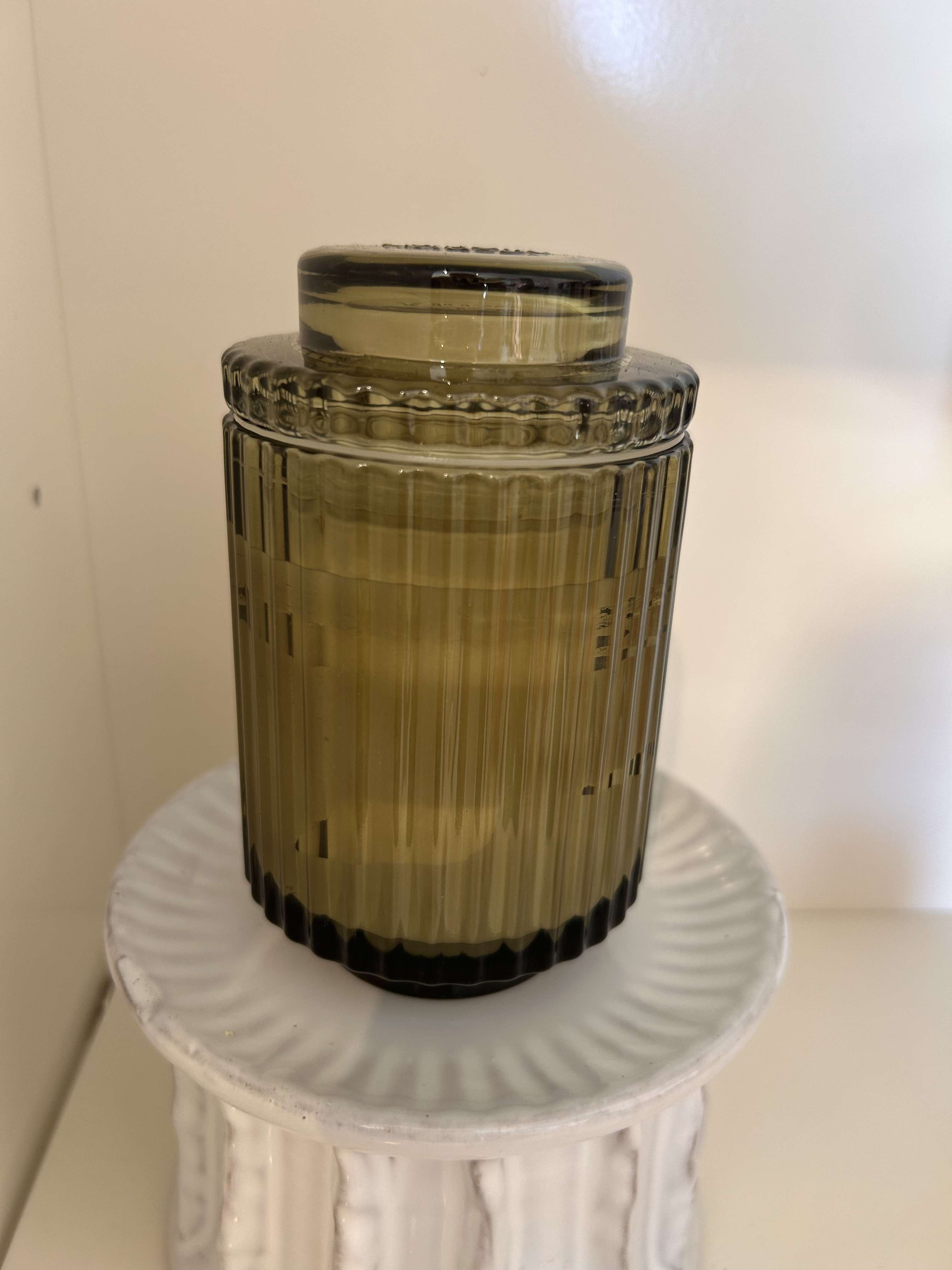 Green Ribbed Glass Candle -  Timeless ribbed glass candles, reminiscent of the Acropolis grandeur. 40-hour burn with natural soy wax and seamlessly become elegant keepsake containers. Top Notes: Mandarin, Green Tea, Bergamot Heart/Middle Notes: Matcha, Jasmine Base Notes: Cedarwood