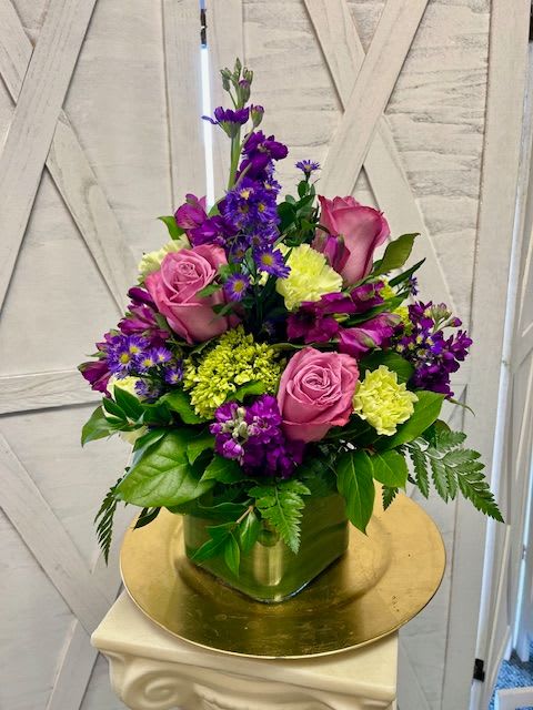 Beloved Bouquet - Beloved Bouquet brings lovely shades of lavender and purple together in a sophisticated cylinder style glass vase. Beloved is an appropriate gift for any occasion. 