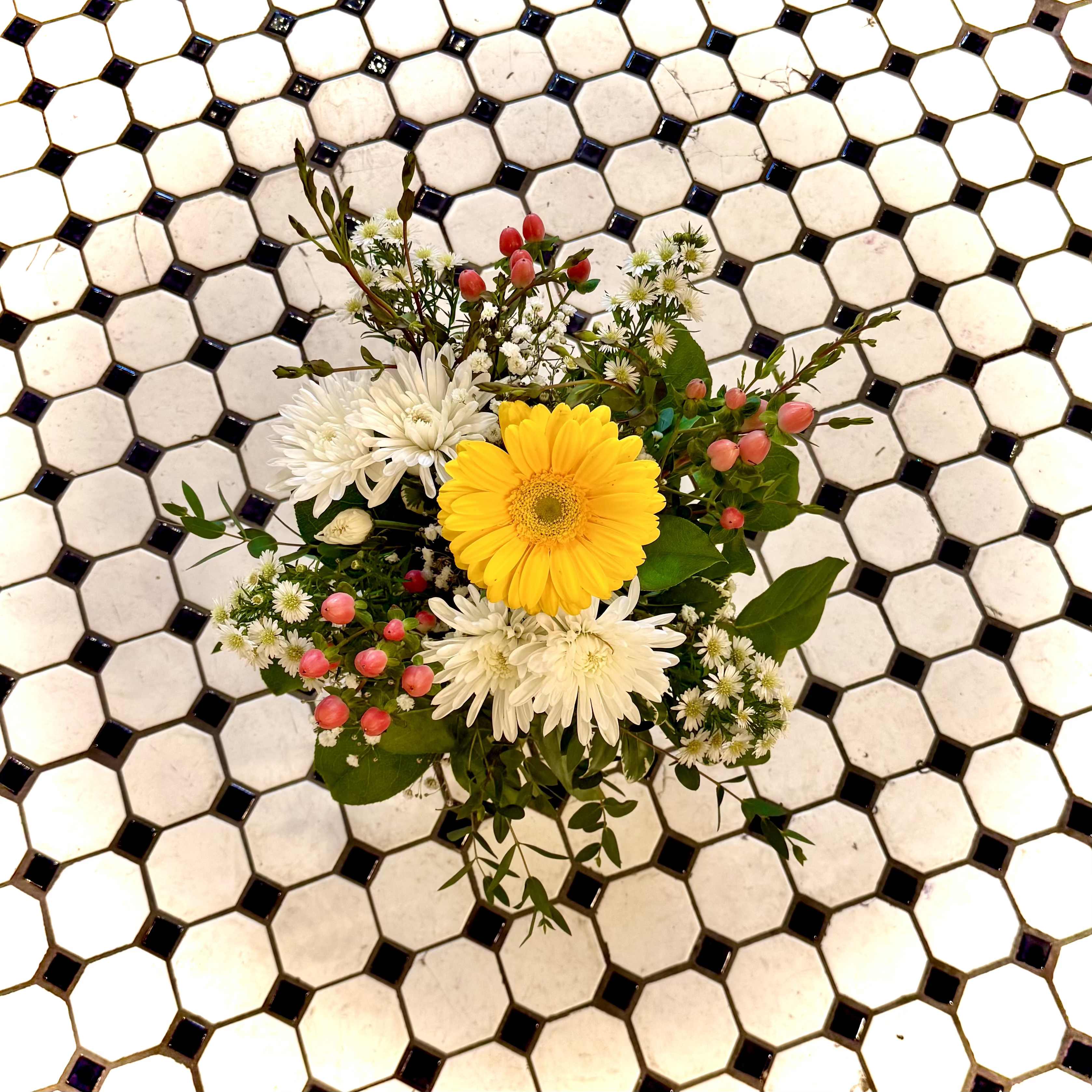Sunny Days - Sunny Days is a bright floral design in colors of yellow, white, red and pink, and features flowers such as Gerber Dasies, Asters, Gypsophila, and Mums. Sure to bring a smile to anyones face!  