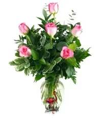Sweet Pink Half Dozen - A simple and elegant arrangement featuring a half dozen soft pink roses, beautifully arranged in a clear glass vase. Accented with fresh mixed greens, this classic design offers a charming and timeless presentation perfect for any occasion. 