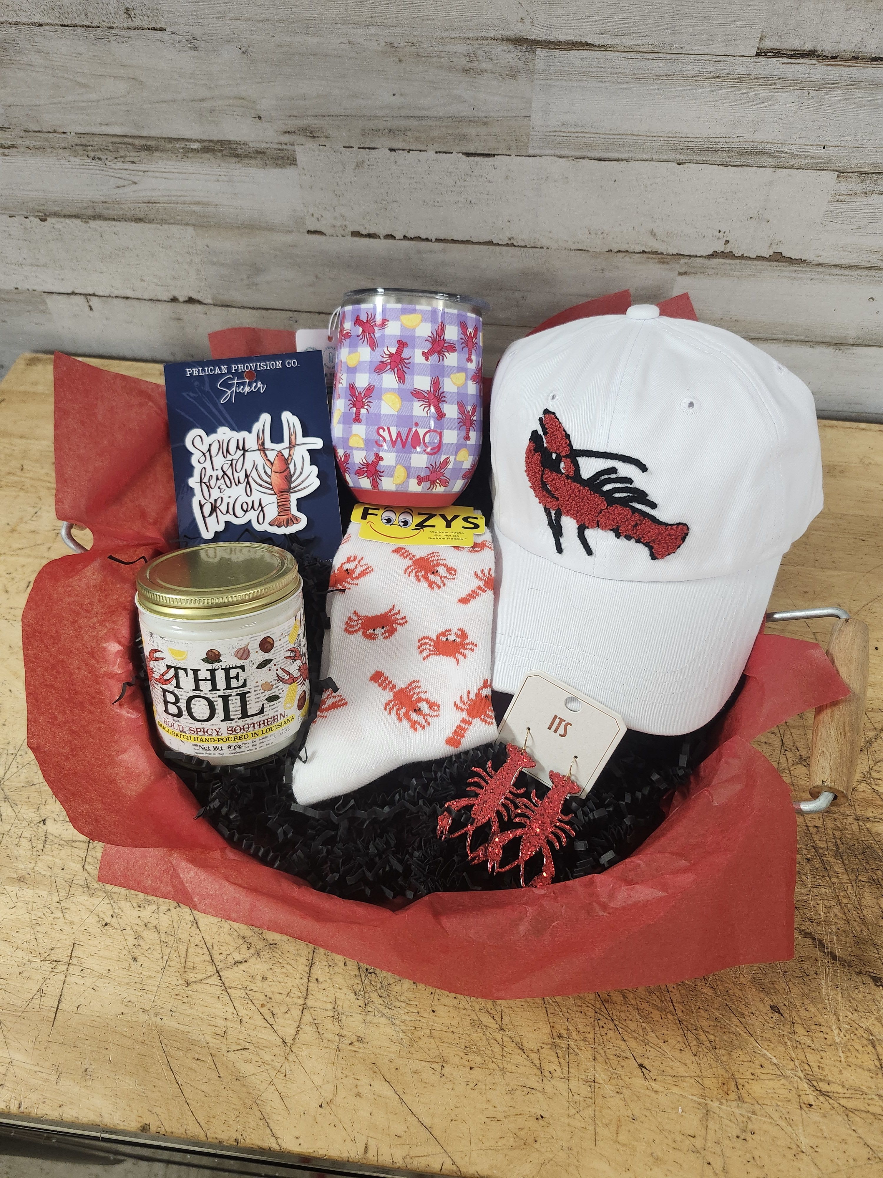 Totally Craw-Some - This awesome crawfish gift tray is filled with gifts sure to please any crawfish lover!  Delivered in a galvanized metal tray with wood handles this gift contains: - Swig - Insulated Wine Tumbler - Adjustable Relaxed Fit Baseball Hat - "The Boil" Candle by Bourbon Royalty - Crawfish &amp; Crabs Socks - Crawfish Earrings - Waterproof Sticker - "Spicy, Feisty, &amp; Pricey" 