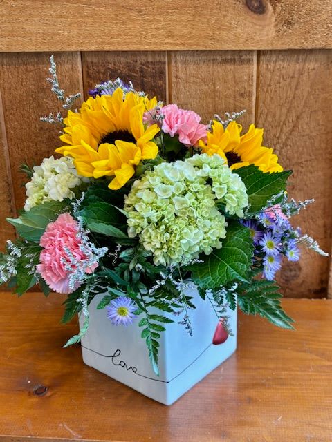 Love in Bloom - Love blooms in this colorful array of garden flowers.