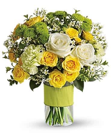 Your Sweet Smile by Teleflora - You could call or email that special someone, but why not put your feelings into flowers? She'll love this elegant array of white and yellow roses and other favorites in a stylish cylinder vase. She'll want to thank you in person. This charming bouquet includes white roses, yellow spray roses, green carnations, green button spray chrysanthemums and white waxflower accented with assorted greenery. Delivered in a glass cylinder vase.