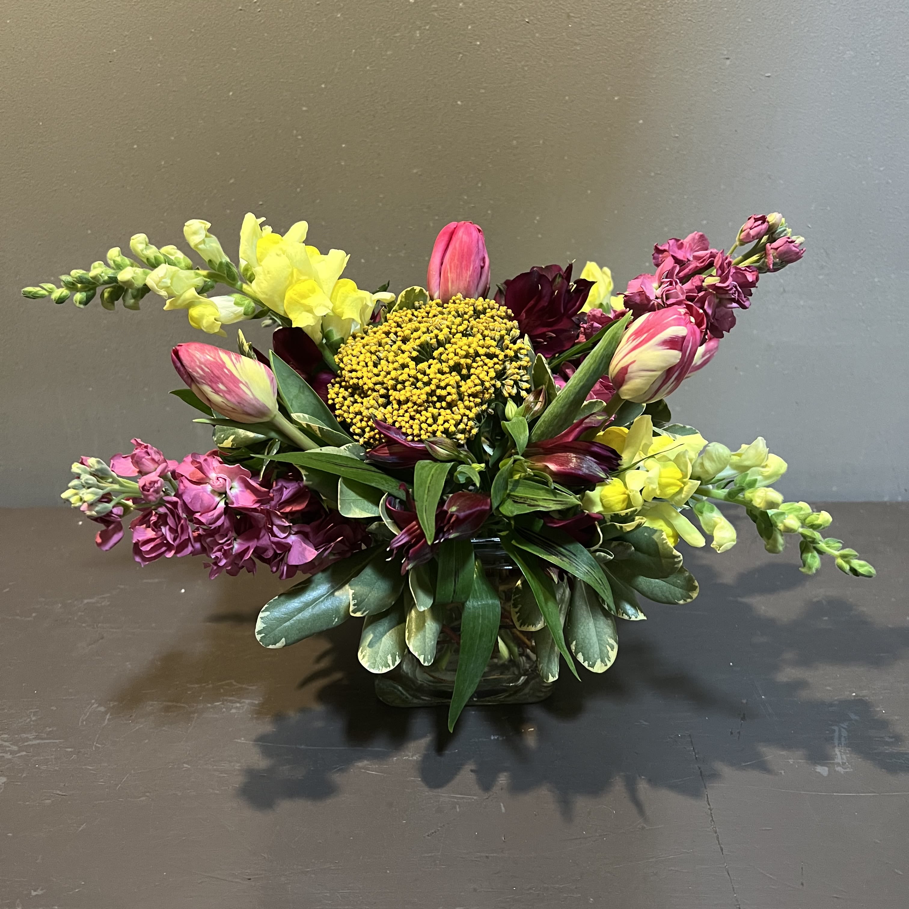 English Contemporary Bouquet - Brighten up your day with a beautiful English contemporary piece!  Measures approx. 15" tall x 11" wide and arrives in a clear, cube vase.