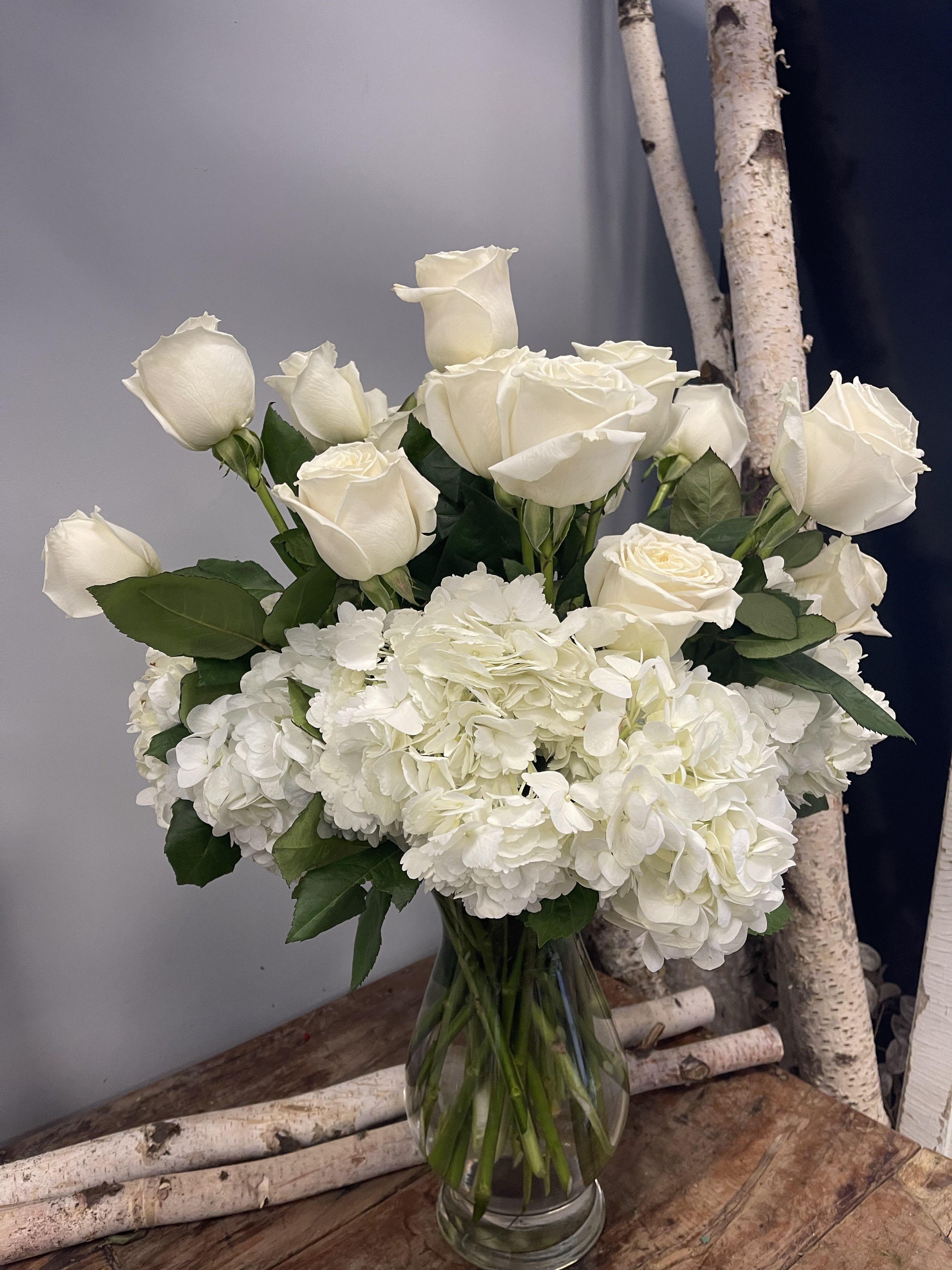 white winter -  white roses surrounded by white hydrangea Perfect to send for everyday or sympathy arrangement
