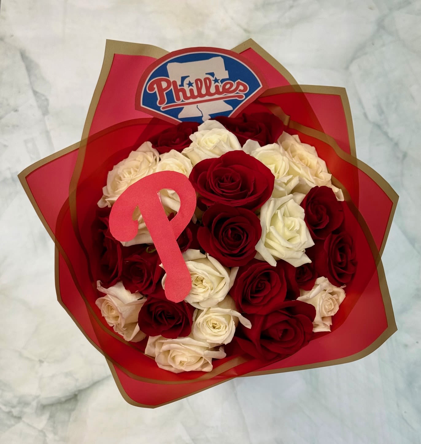 Fightin' Phils Bouquet - Celebrate the Philadelphia Phillies with this special custom bouquet of 12 red and 12 white roses wrapped round with the Phillies logo attached. 