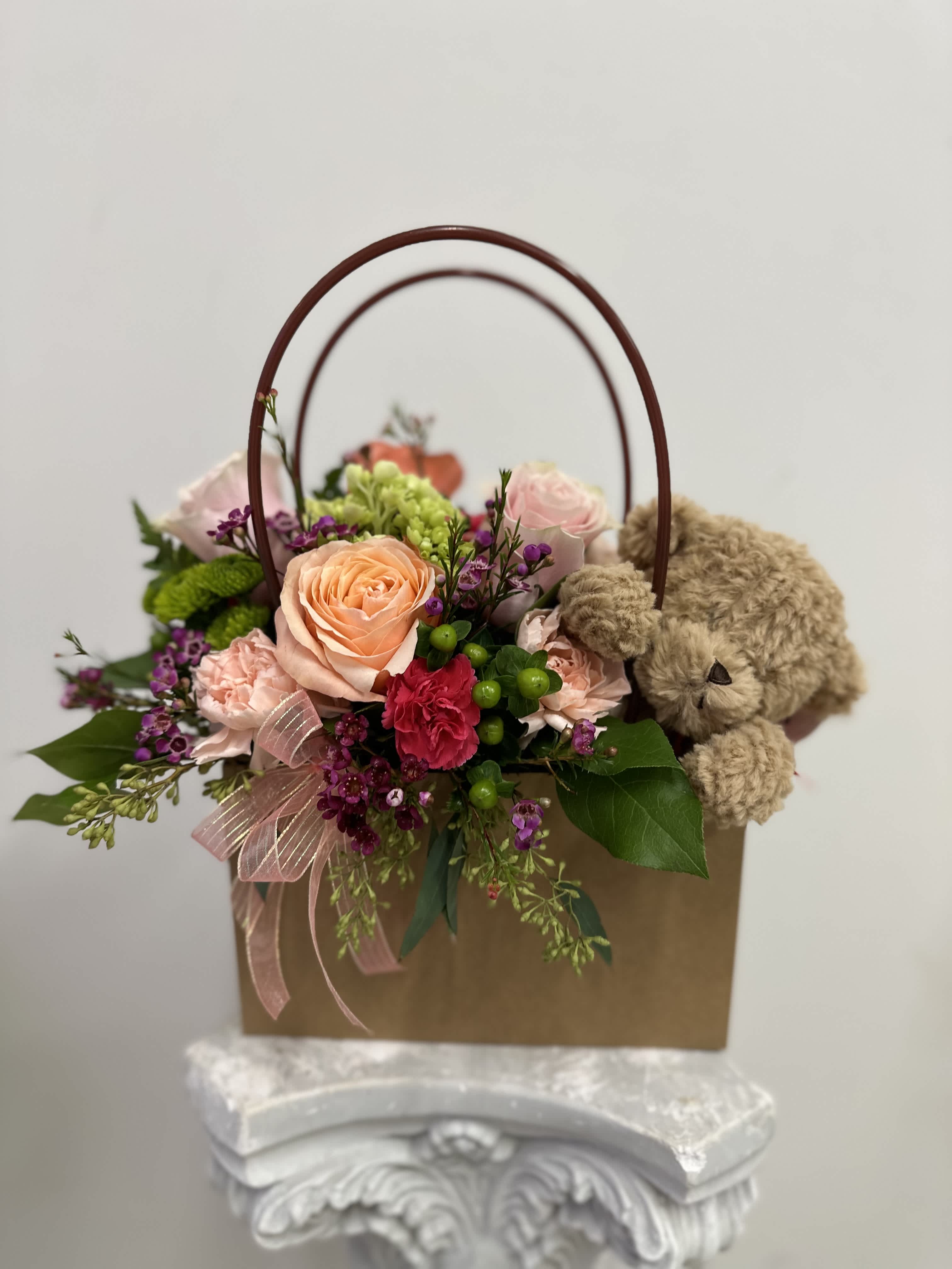 Flower gift bag with plush bear by Westford Florist Art by Veny - Surprise your loved ones with our adorable Flower Gift Bag arrangement with Plush Bear! by Westford Florist Art by Veny This unique and modern design by Westford Florist is perfect for any occasion, whether it's a birthday, anniversary, or just because. The plush bear adds an extra touch of sweetness to the beautiful flower bouquet. Show someone you care with this special gift by Westford Florist Art by Veny that they will cherish forever. Order yours today and spread some love and happiness!