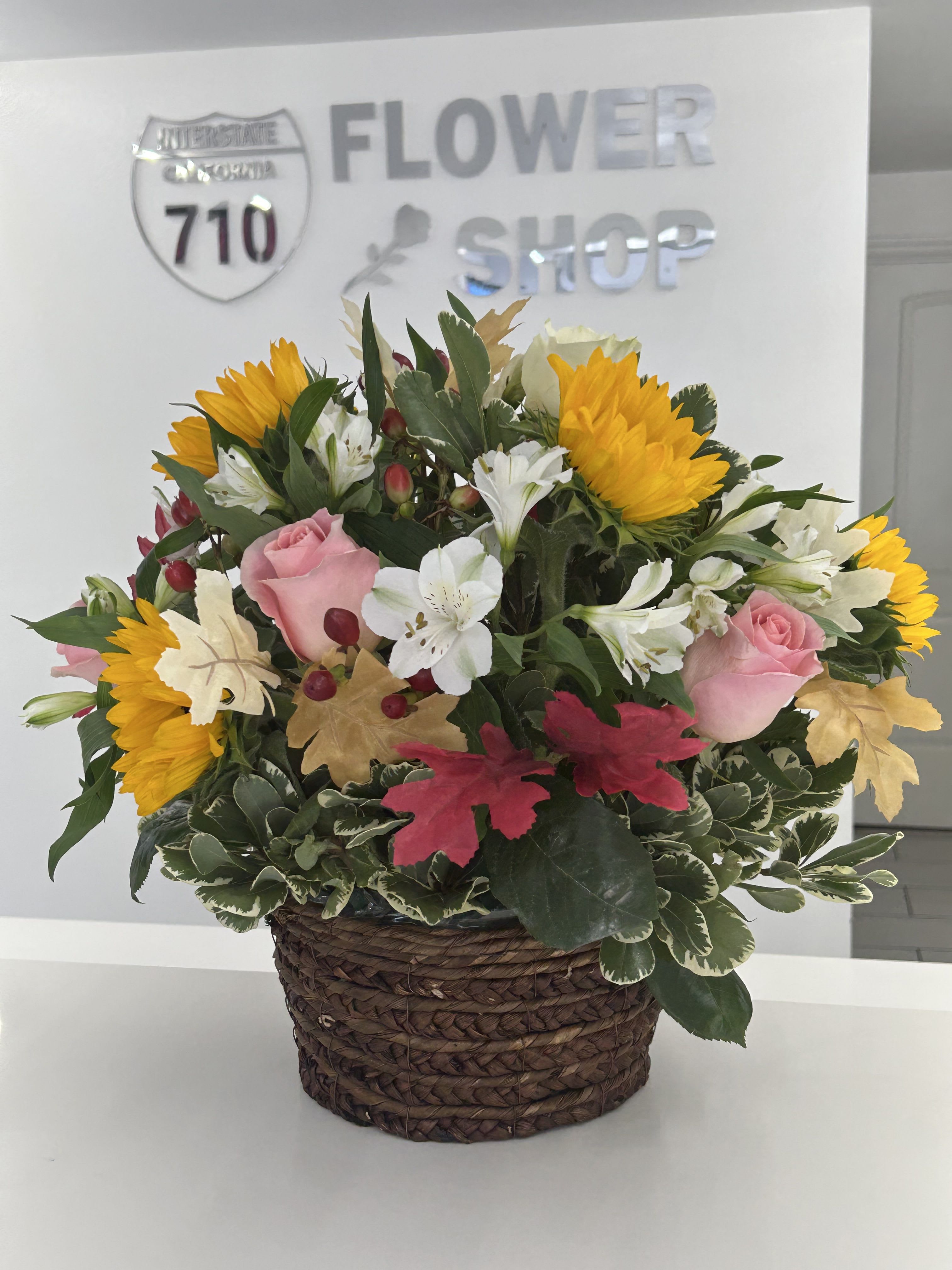 Bloom Basket by BloomNation™ - We all love picnic baskets. What about flower baskets? Instead of being filled with nourishing food, this Bloom Basket nourishes the soul! Nourish your soul, or the soul of a loved one, with a few servings of autumn wonderment with this Bloom Basket. You will not regret it. Substitutions: If some flowers and/or the vase are not available there will be minor substitutions.