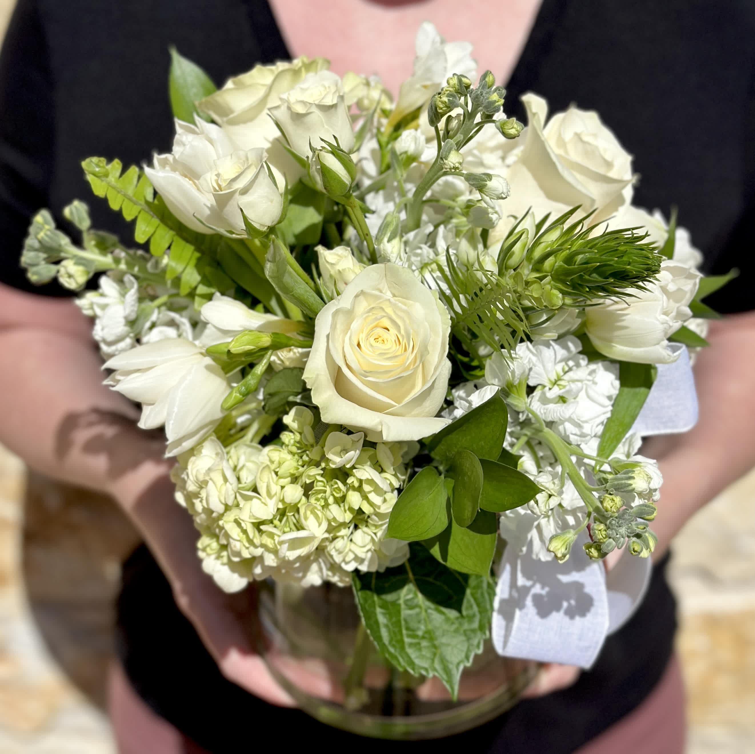 Creamy Seasonal Garden  - An elegant seasonal garden mix in creamy whites and greens. Arranged low and dense in our signature English garden style. Delivered in a clear glass vase. Floral varieties may vary but will be of similar quality and style. Overall design is approximately 11" x 11" in the standard size. 