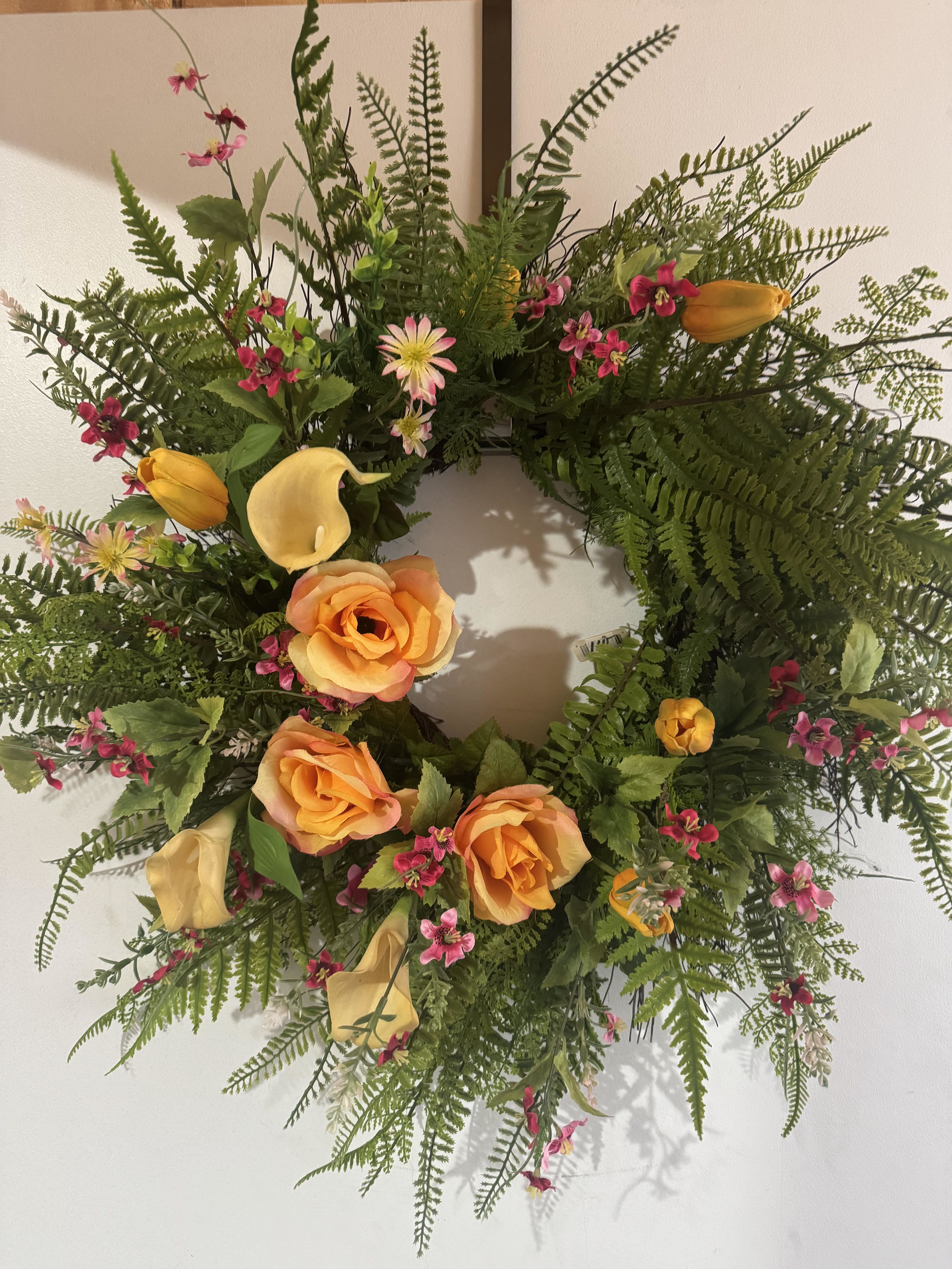 IN THE TROPICS (PERMANENT WREATH) - A tropical feeing wreath including faux blooms in yellows, oranges, and pinks