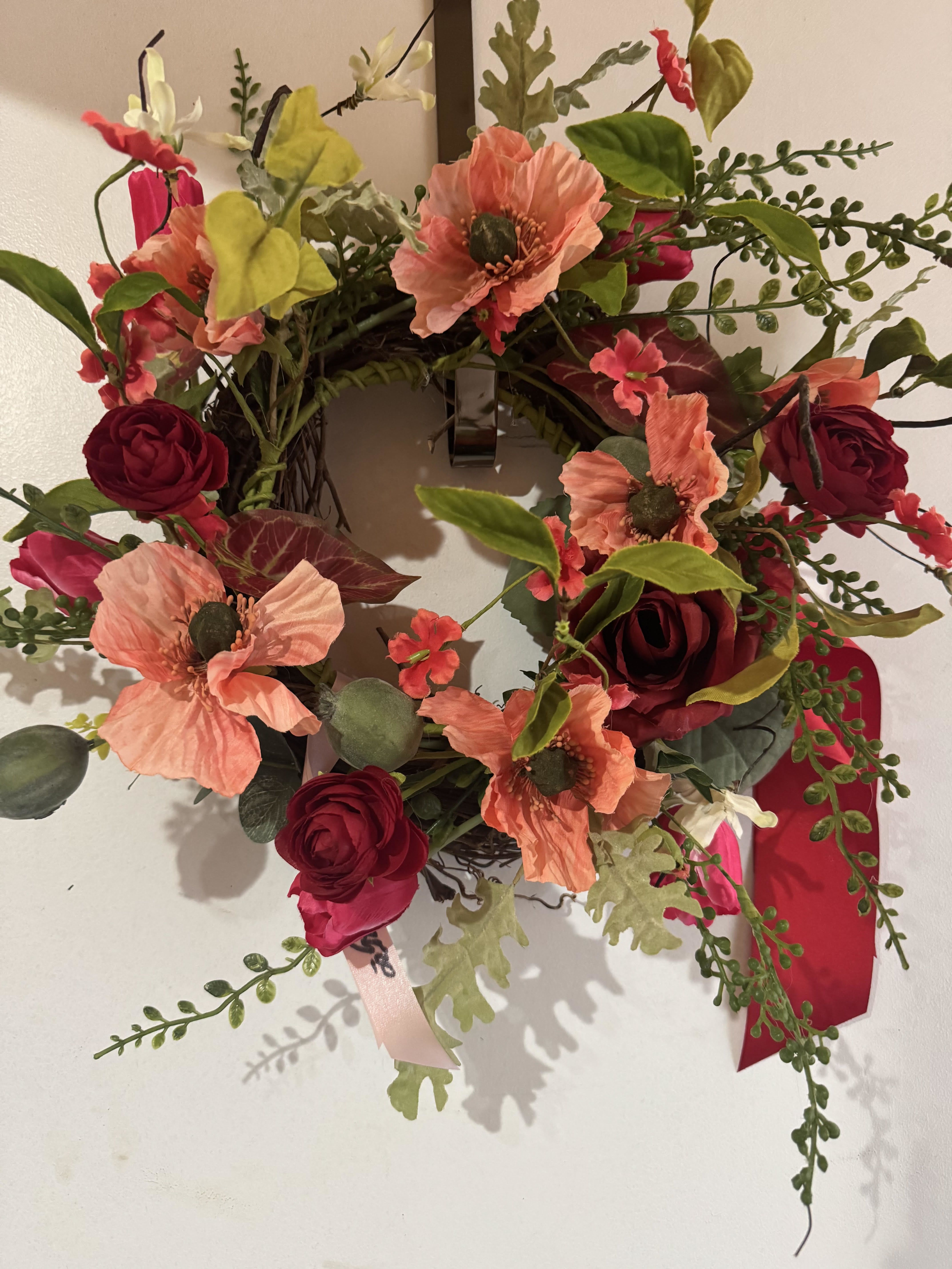 LOVELY REDS (PERMANENT WREATH) - A small permanent wreath with all shades of red faux blooms