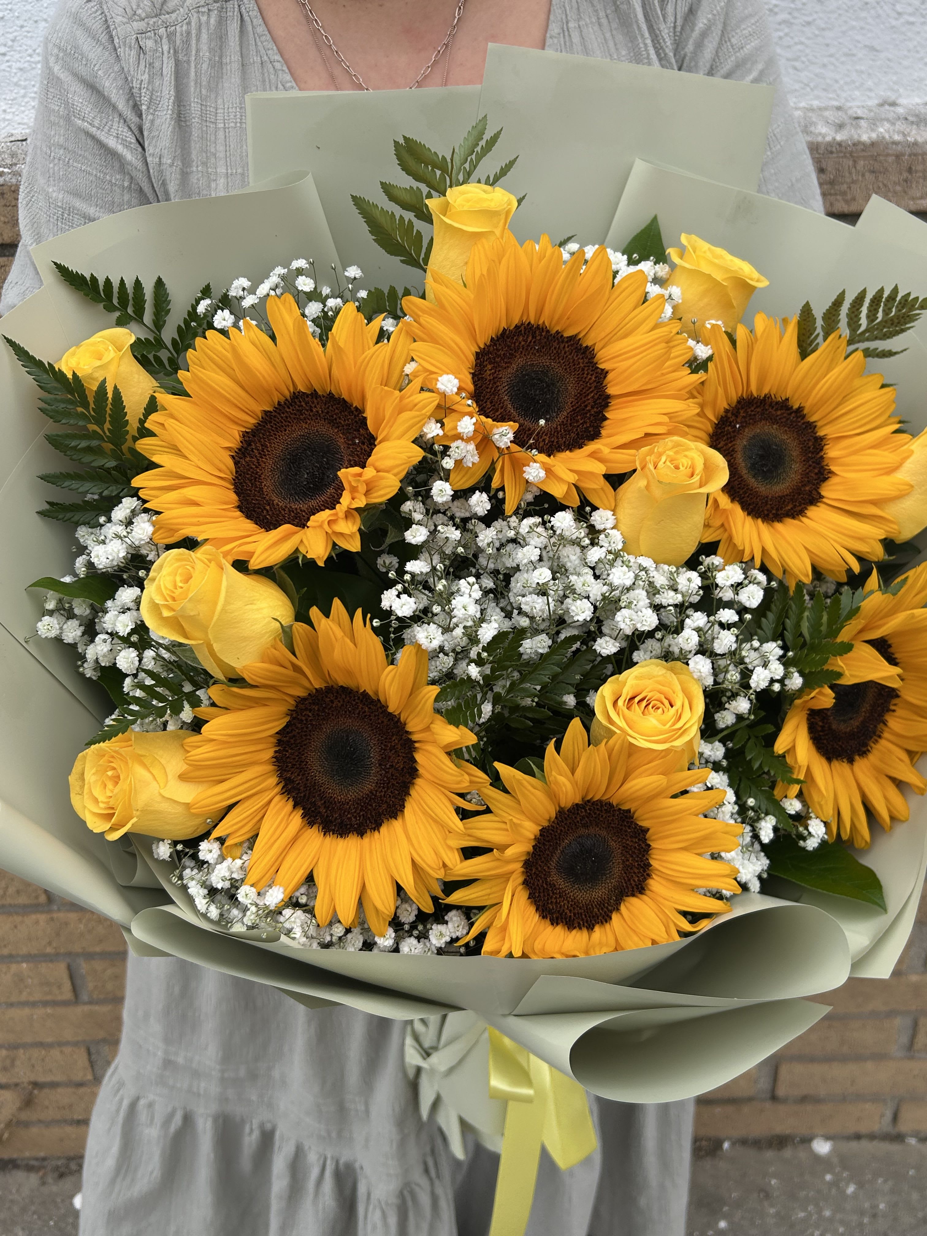 Flores Amarillas  - Wrapped bouquet made specially to brighten that special persons day. 