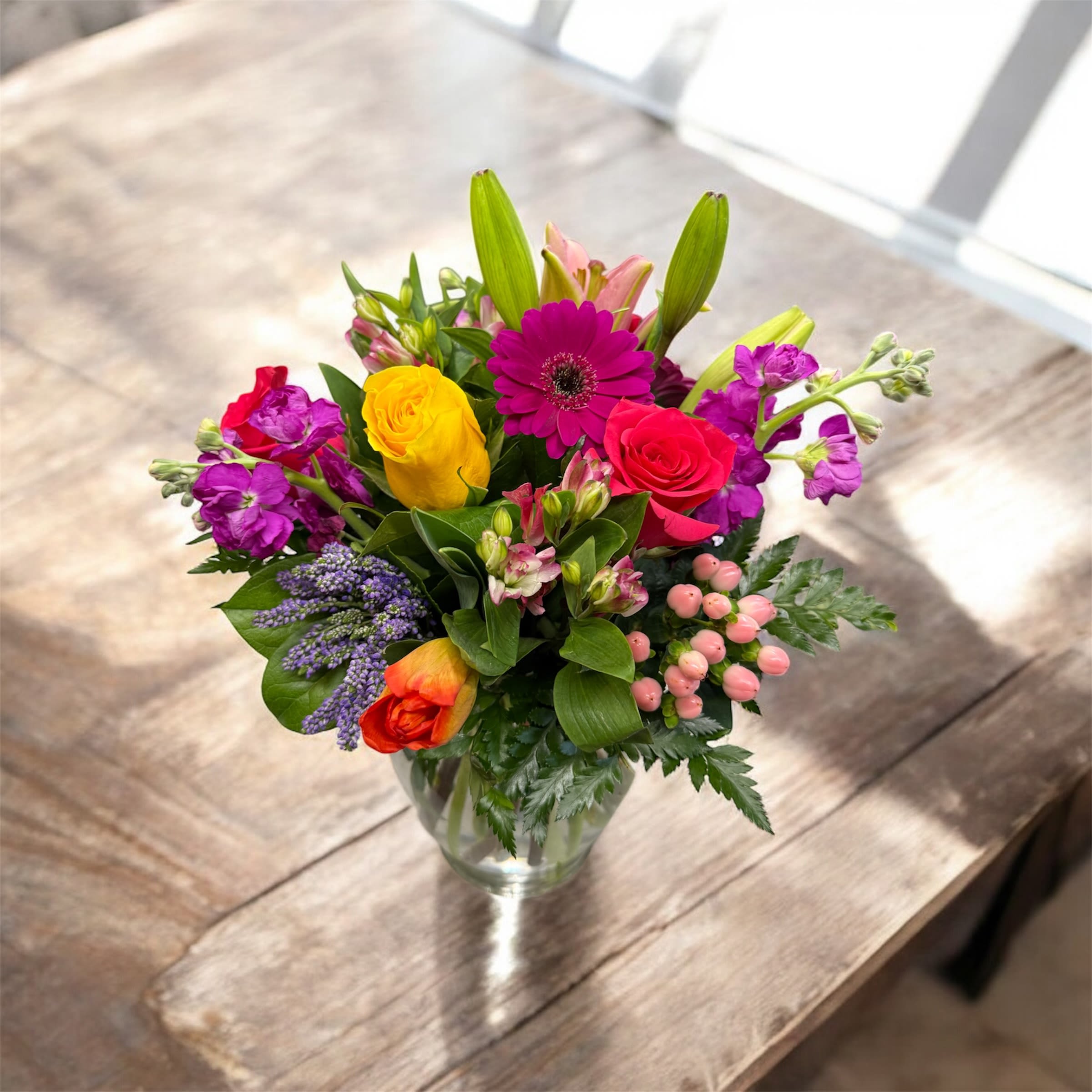 Designer's Choice Birthday Vase Arrangement - We believe that a floral arrangement is a must for a happy birthday. Our unique custom made arrangements will reflect the emotion of the birthday. Every design is built by our expert designers to match the needs and budget of our customers, and to complement all aspects of your special day. Allow us to make your day!