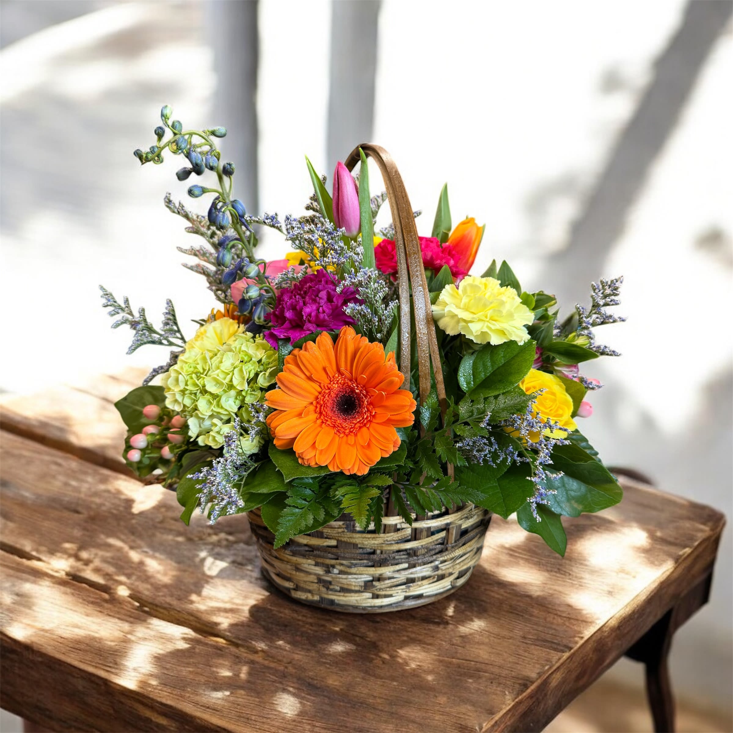 Designer's Choice Basket Arrangement - You're not sure what kind of flowers your receiver prefers? Allow our team of expert designers to create a bouquet full of vibrant, beautiful blossoms made for any occasion! Using in-season flowers, each unique and custom made arrangement in this style is handcrafted and one-of-a-kind.