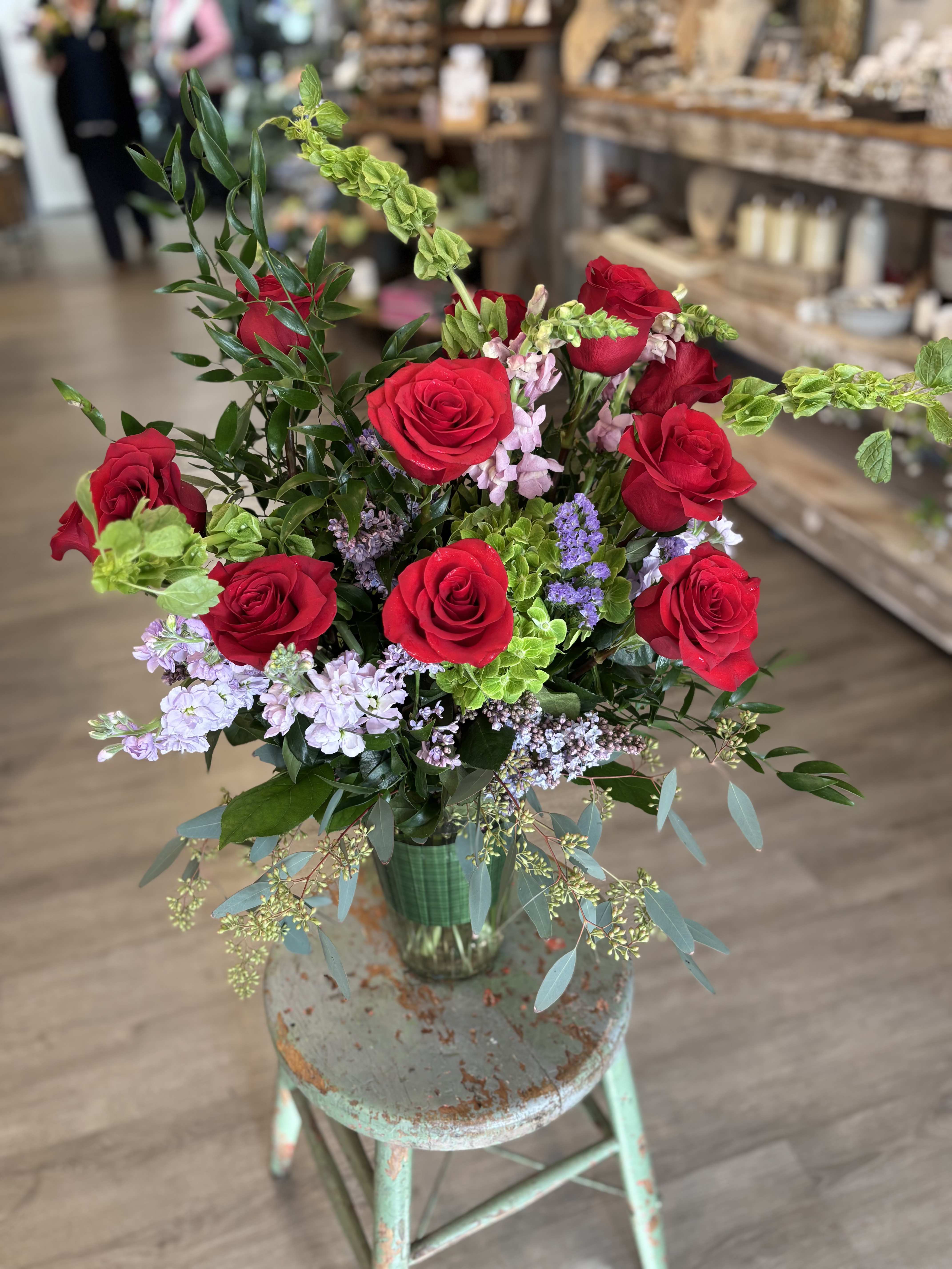 The Gardener's Dozen  - A fresh take on the classic dozen - luxurious red roses designed in a loose, garden style with season blooms such as hydrangea, elegant snap dragon and fragrant eucalyptus.  A romantic gesture for Mother's Day or any day that needs to feel just a bit more luxe. 