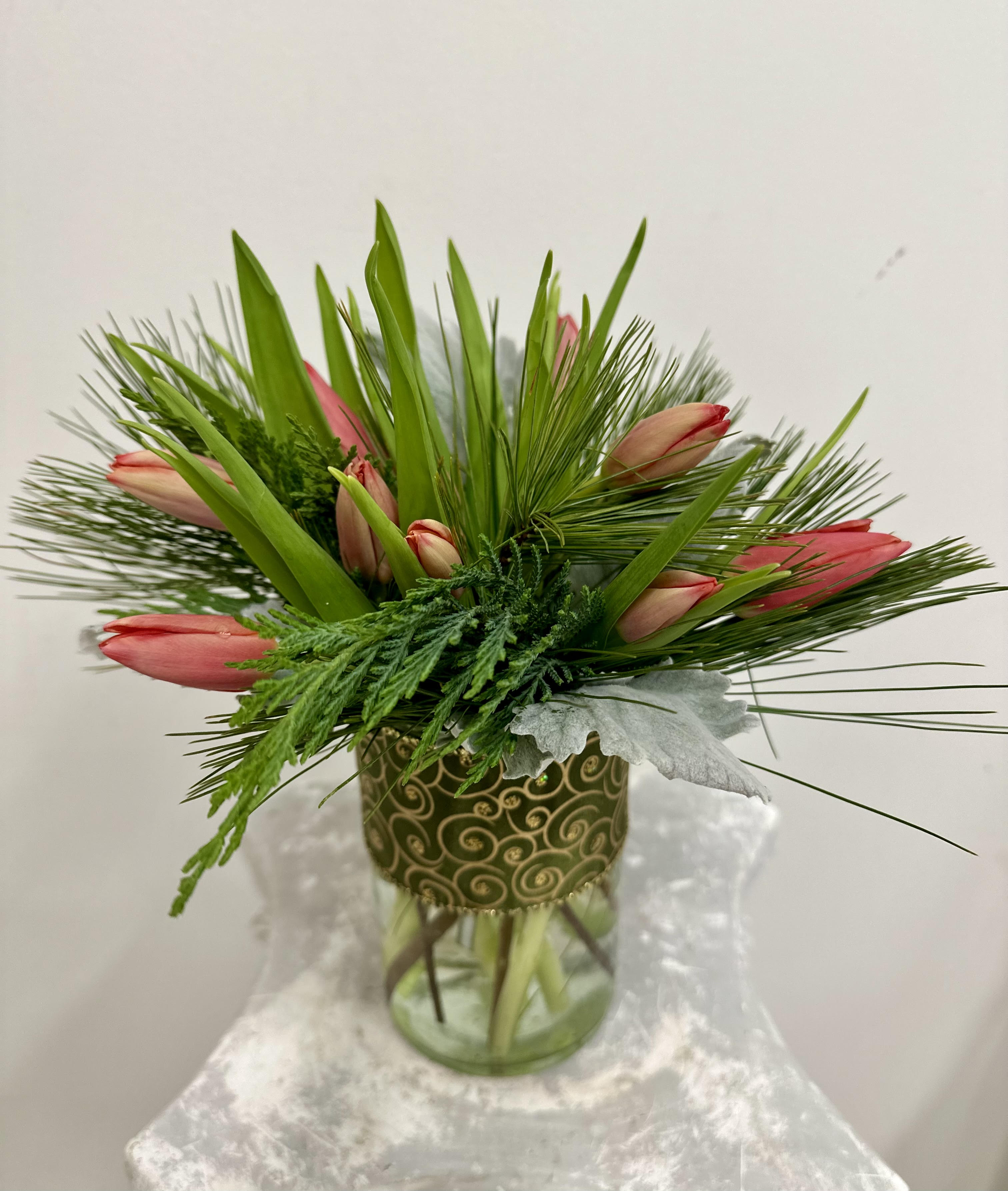 Spring Whisper by Westford Florist Art by Veny - Brighten your day with the enchanting "Spring Whisper" arrangement from Westford Florist Art by Veny. This exquisite collection features ten stunning tulips, elegantly presented in a chic vase, designed to infuse any space with a touch of vibrancy and charm. Available in classic white, passionate red, or a delightful mix of hues, these fresh blooms are perfect for elevating your mood or making a statement in your home or office. Experience the joy of spring all year round as you indulge in nature's beauty—an ideal gift for yourself or someone special.