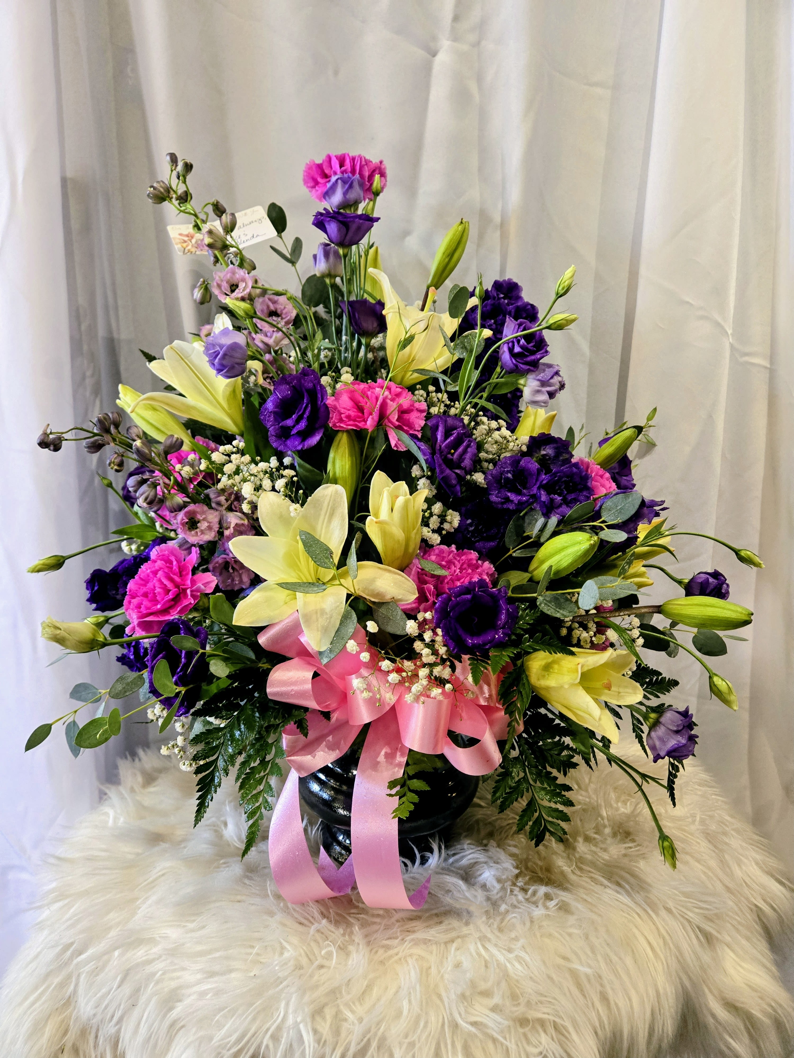 Medium Sympathy Arrangement - Colors and flowers may vary based upon availability.