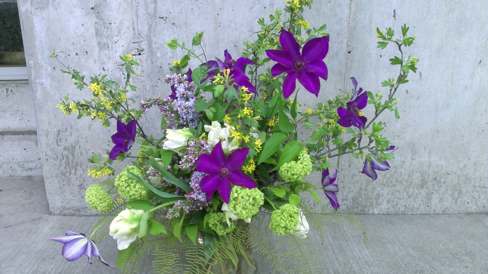 Spring Sprung - Whimical mix of the best of the season  ***Please note that Emerald Petals creates with the seasons. What you see pictured is a representation of our style and the general size of the bouquet, intentional substitutes will be made as needed as all of our arrangements are one of a kind like you **A clear vase will be used unless specified