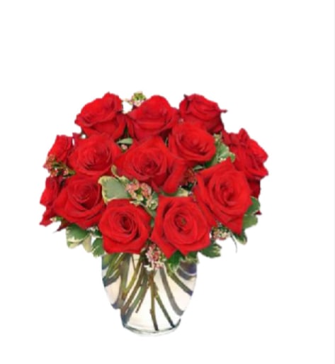  CLASSIC ROSE ROYALE Item CLASSIC ROSE ROYALE - A lush dome of vivid red roses takes center stage in this classic rose arrangement, a perfect birthday bouquet, anniversary roses gift, or romantic surprise for the person you want to make feel deeply cherished. The rounded, compact shape reads timeless and intentional-she'll feel seen and celebrated the moment the box is opened. Subtle pink filler blooms and fresh variegated greenery peek between the roses, softening the intense red and adding a tender, textured finish.  Arranged tightly in a clear glass vase, the stems are visible and neatly organized in water for a clean, traditional presentation that suits a mantel, bedside table, or desk. Colors include rich red, soft pink accents, white highlights and fresh green foliage; flowers are primarily roses complemented by delicate filler florals. This is an elegant choice for anniversaries, Valentine's Day, or simply to say "I love you" with unmistakable romance-easy care: trim stems and change water regularly to keep the bouquet looking its best.