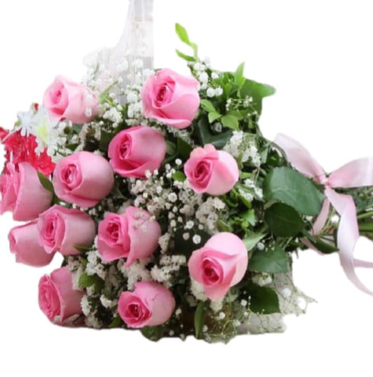 Pink Promise Bouquet - A cluster of medium-stem pink roses tied into a plush, hand-tied bouquet - the Pink Promise Bouquet reads as a gentle, romantic gift perfect for anniversaries, birthdays, or a just-because romantic gesture. The close, rounded arrangement creates an immediate visual of abundance and tenderness, so the person you're thinking of will feel genuinely adored the moment they see it.  Soft white filler flowers are interwoven through the pink roses to add light, airy texture and a delicate contrast that makes each rose pop. Stems are gathered and wrapped with decorative mesh and wrap, then finished with a pale pink ribbon bow for a refined, feminine finish. Colors run through shades of pink with touches of white and fresh green foliage, creating a timeless look that suits both celebratory and everyday gifting.  This bouquet is sized for easy hand delivery and displays beautifully in a simple vase - the kind of arrangement that makes someone feel truly seen and cherished. Order with same-day pickup or local delivery when available; keep stems refreshed with clean water and a fresh cut to extend the life of the roses.