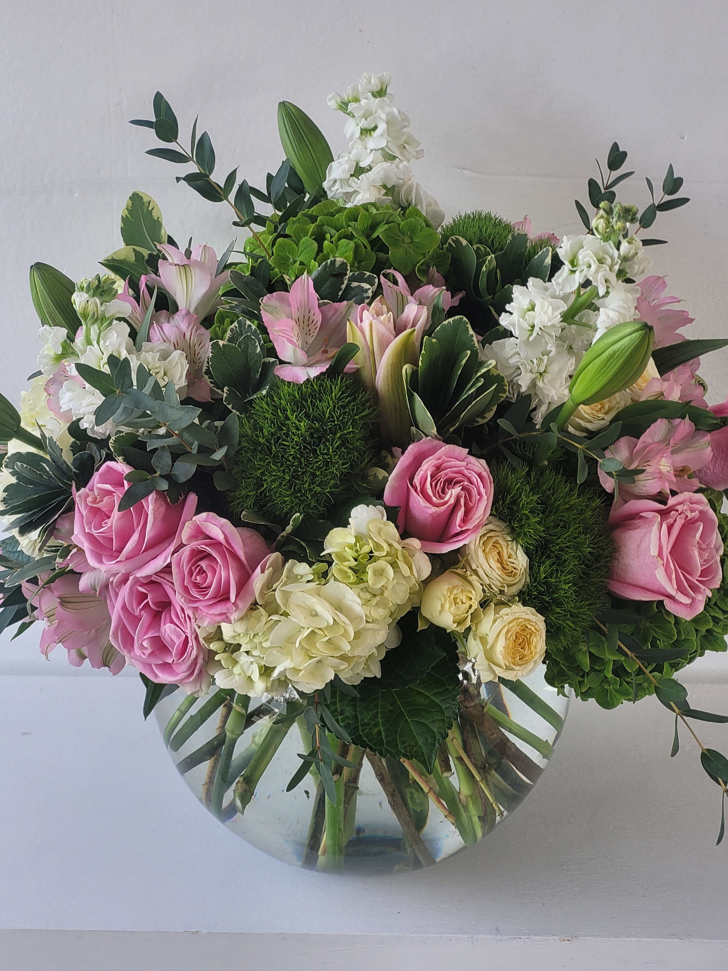 Blush garden - A soft, garden-inspired arrangement with pink roses, delicate blooms, and lush greenery-perfectly fresh, romantic, and elegant.