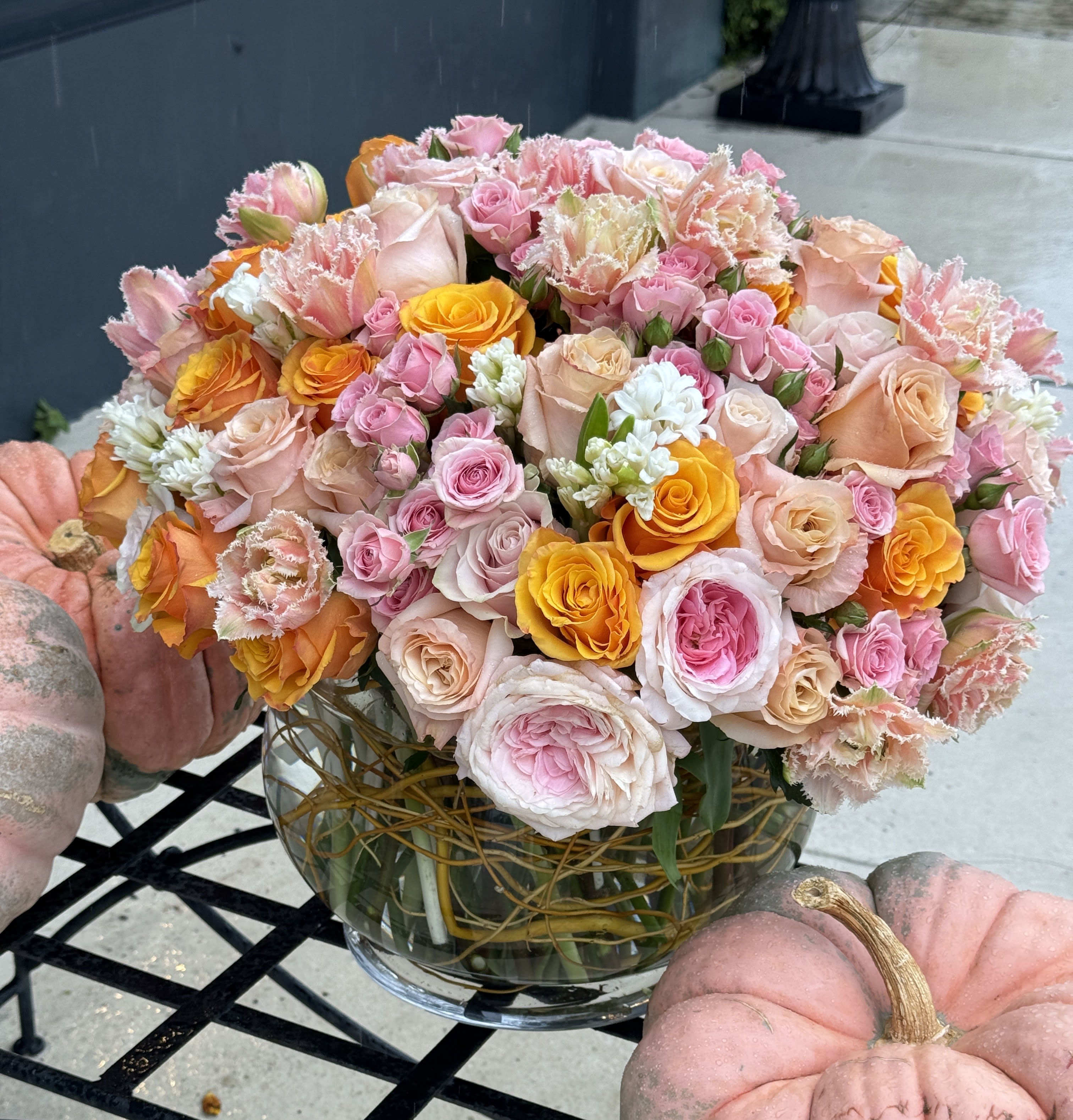 Country Garden - Elegant large bubble bowl filled with spring bulb flowers such as tulips &amp; hyacinth, pink lilies, garden roses, wrapped with curly willow to complete the garden inspiration. **VASE AND FLOWER MAY VERY **