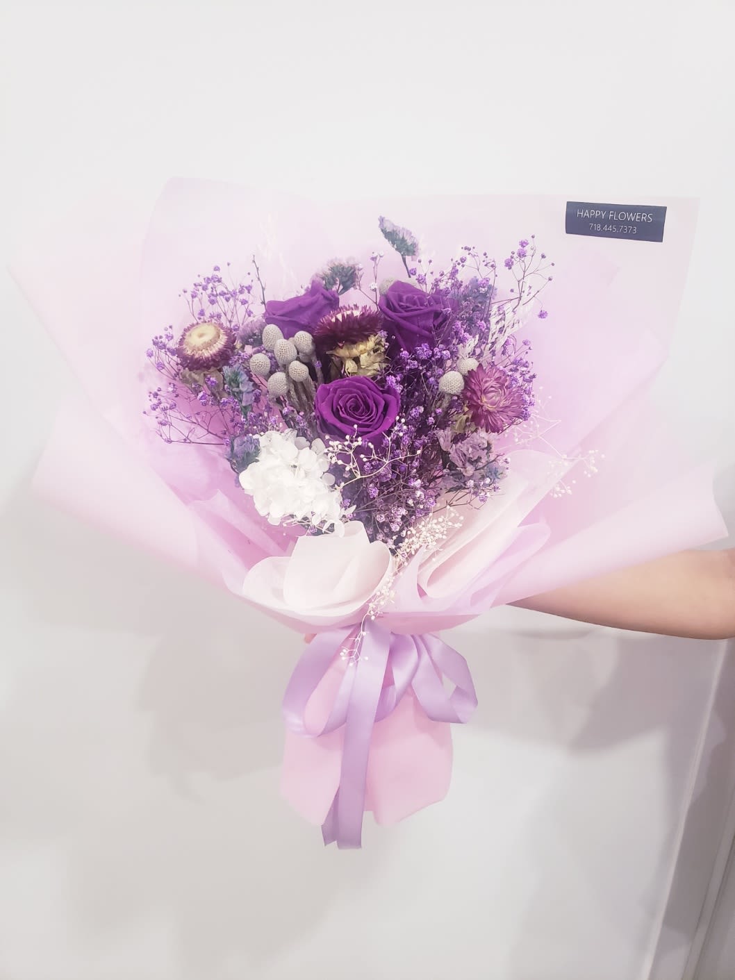 purple  preserved rose bouquet - 3 purple preserved roses and 2  purple straw flowers and purple baby's breath  wrapped in soft  lavender Korean-style papers.