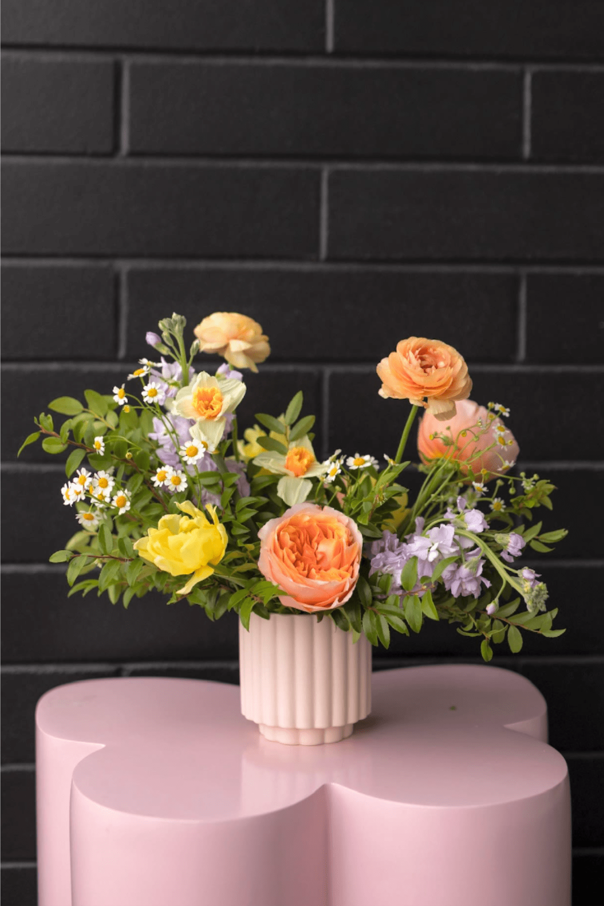 Spring Designer's Pick - Step into spring with this stunning arrangement, showcasing fresh seasonal blooms in soft, elegant pastel hues.