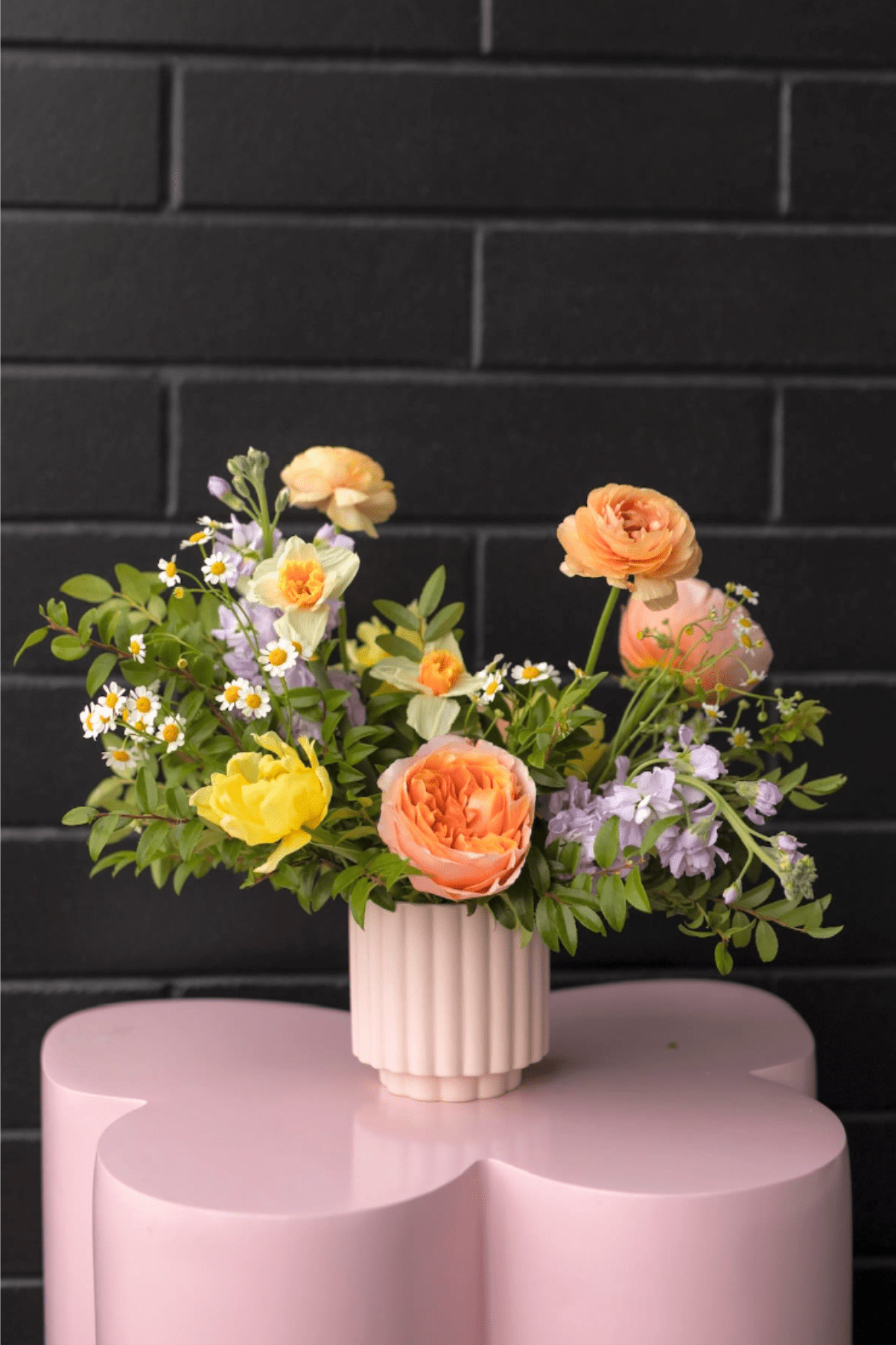 Spring Designer's Pick - Step into spring with this stunning arrangement, showcasing fresh seasonal blooms in soft, elegant pastel hues.