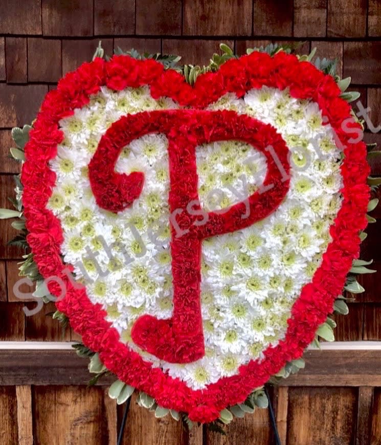 Sports Fan Funeral Tribute - Show the departed the love for their team. We can make any teams logo in the center of the very large 24 inch heart. Presented on a 6 foot easel, this will be the show piece of any funeral service. (We require 24 hours notice to create this piece)