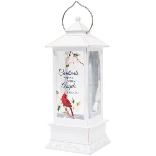 "CARDINALS" WATER GLITTER LANTERN - Our water glitter lanterns are designed with quality and sentiment in mind. The high-quality poly resin lantern features a built-in LED light and circulator for swirling glitter. The light also includes a 4′ USB Power cord. 3 AAA batteries are included.  W: 4 1/8" H: 12 1/4 " DIA: 4 1/8"