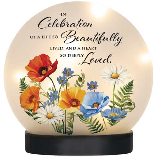 "DEEPLY LOVED" LED TABLE DECOR - Our LED Table decor is made of hand blown glass and resin. Features LED string lights, an ON/OFF switch (3 LR44 batteries included).  W: 8" H: 8" DIA: 3 "