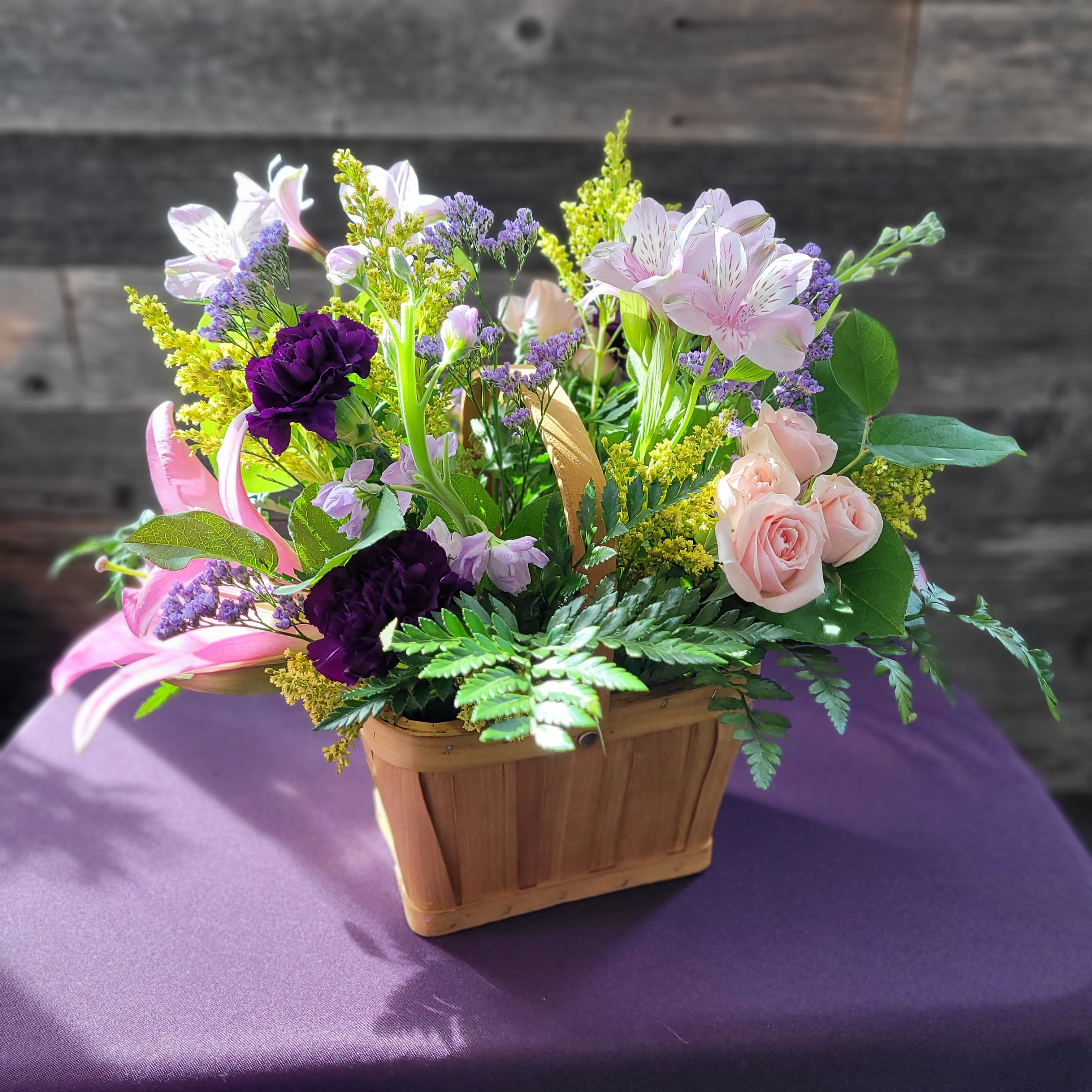 Garden Serenade - Soft pinks, rich purples, and fresh greens in a garden-style basket—lush, romantic, and a little wild.