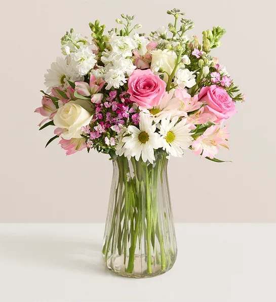 BN Love You Mom - Created just for Mom to let her know how much you appreciate her.   A clear vase with pink and white roses, white stock, white daisies and pink alstroemaria.