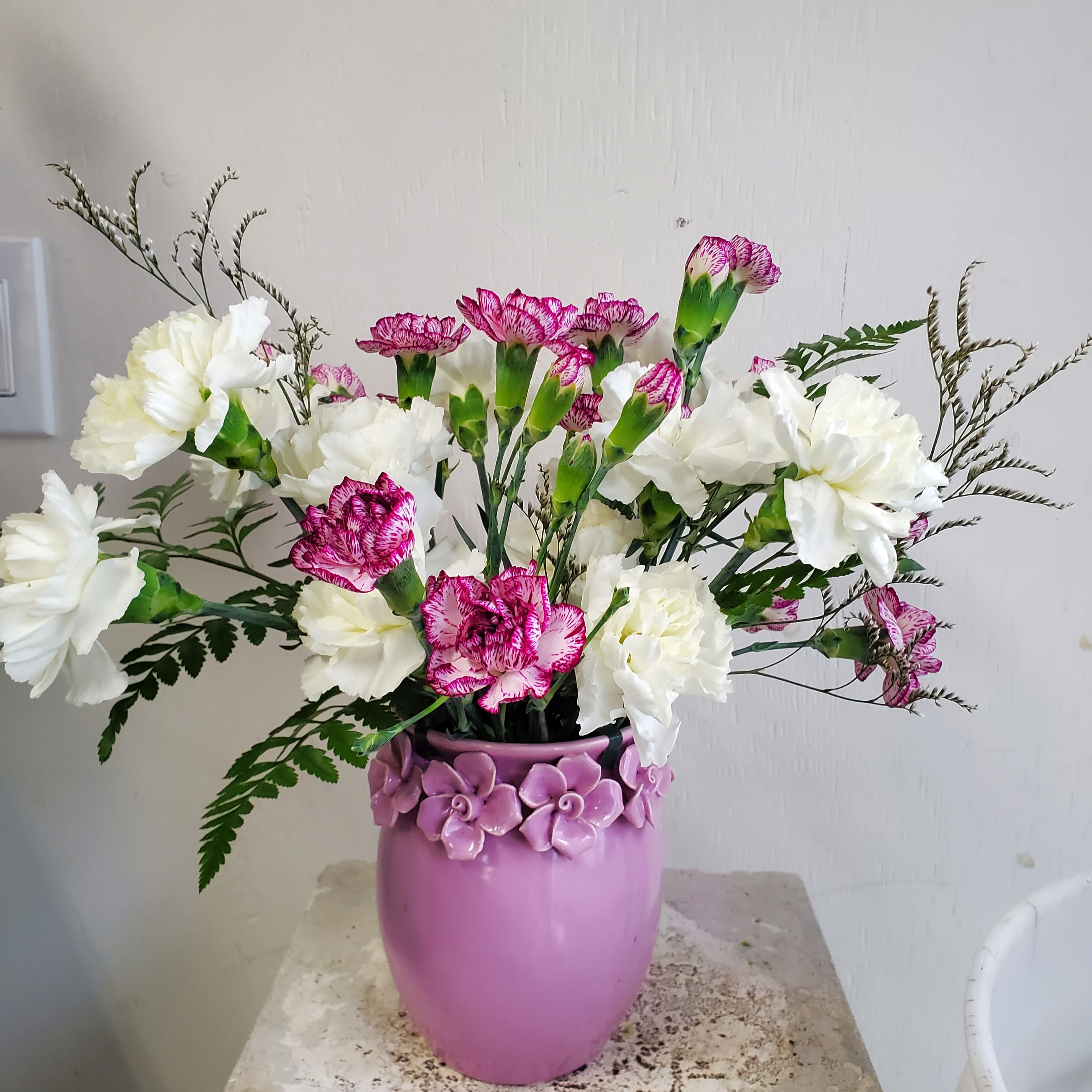 Soft Love - We are a small studio florist in a small town. Every bouquet we create is a one-of-a-kind creation, tailored to the season, availability of flowers, color choice, artistic interpretation, and the current materials available. The photos do not represent the exact flowers that will be delivered. They are intended to provide you with an idea of what we do, how we do it, and the variance that can be expected.The season, availability of flowers, color choice, artistic interpretation, and the current materials available. The photos do not represent the exact flowers that will be delivered. They are intended to provide you with an idea of what we do, how we do it, and the variance that can be expected.