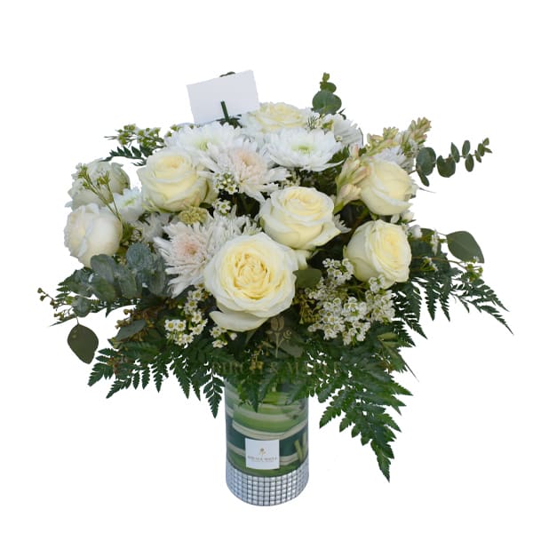 Peace And Calm - This extremely lush and eye catching bouquet has premium creme roses and greens arranged to perfection. This elegant 30 inch bouquet creates a sense of calm and sends out positive vibes wherever you place it.For same day delivery and Free Delivery Options Text or Call  832-973-1376. Height-22"