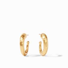 Pair of small textured gold hoop earrings on a white background