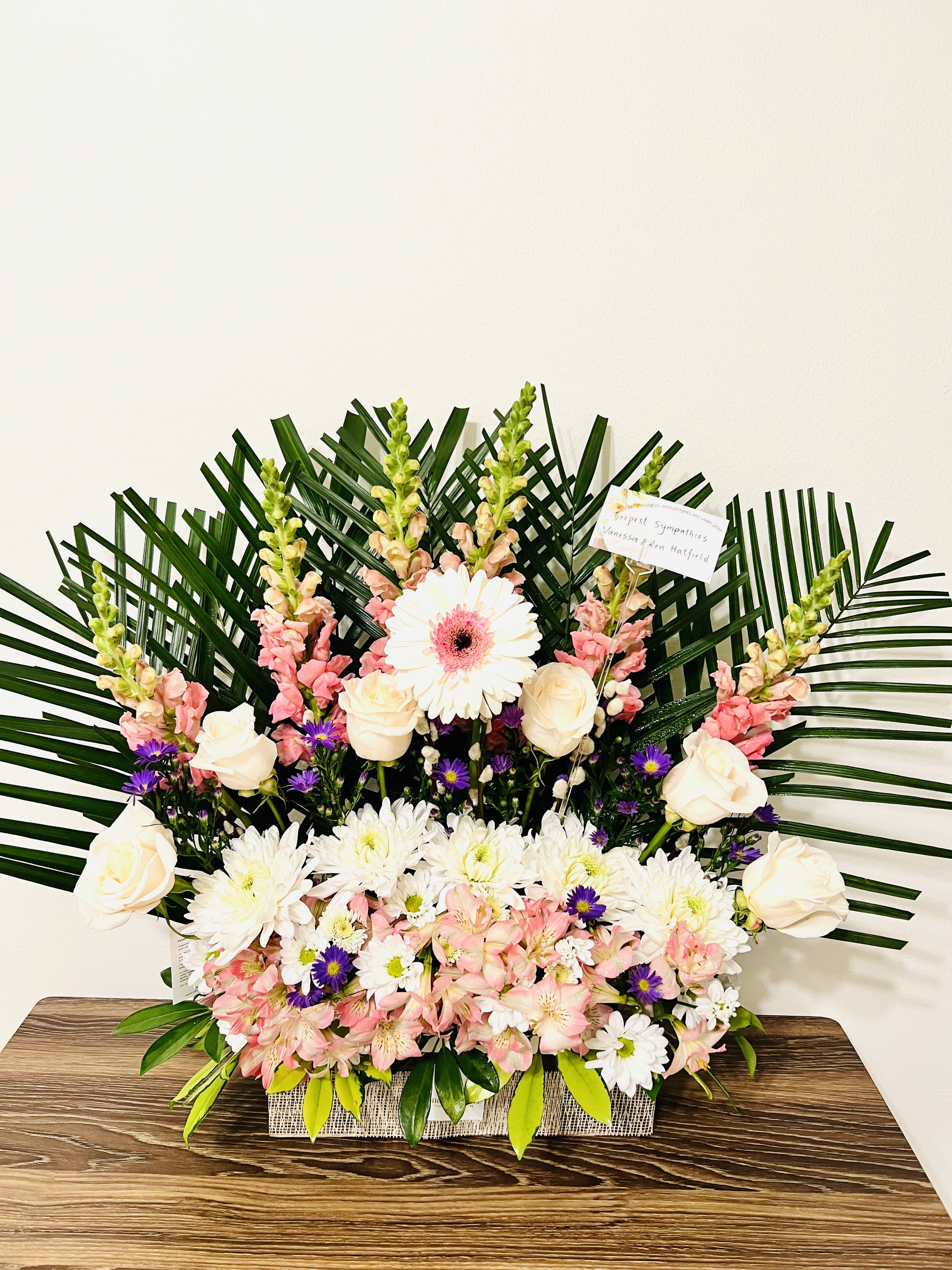 Summer Cloud - This harmonious  arrangement is to celebrate those who left indelible impressions on our lives . whites pinks and purples have been used by our designer as a tribute to the  joyful memories of our loved ones which envelope us like a cloud .For same day delivery and Free Delivery Options Text or Call  832-973-1376.