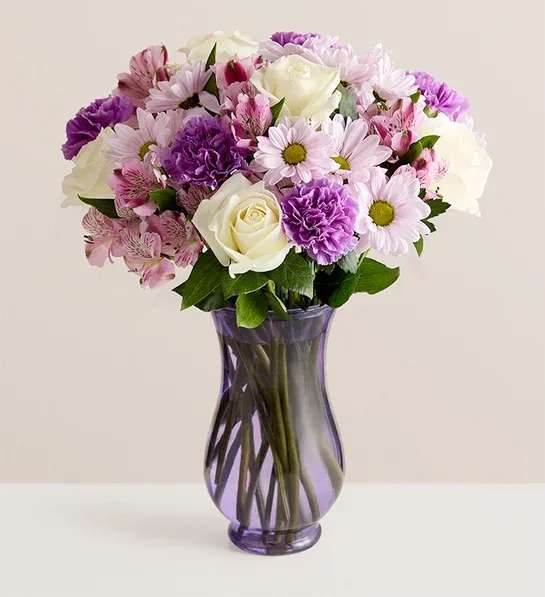 BN Lavender Garden for Mom - A mix of blooms in the sweetest shades of lavenders and white in a lavender vase. 