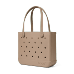 Bogg Bag Baby - Camel - Meet the mid-sized tote that does it all. The Baby Bogg Bag is a durable, washable, and tip-proof carryall—perfectly sized for everyday adventures.  Smaller than the Original but still spacious, this versatile tote fits your personal essentials without the bulk. Use it as a gym bag, pool bag, or day bag—it’s lightweight, easy to clean, and built to last.  Includes a small insert pouch for must-haves like your phone, keys, or lip balm—because the little things matter, too.  Best for: Everyday use, short outings, personal essentials, and on-the-go moments.