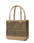 Tan tote bag with leopard print panel and long matching handles on a plain background