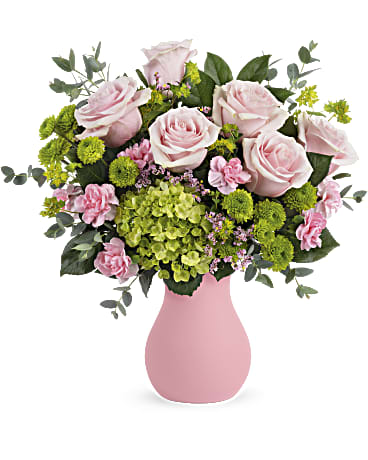 Breezy Pink Bouquet - Fresh as a breeze! Surprise someone special with this playful pop of pink roses and green hydrangea in a frosted pink glass vase. This breezy bouquet includes pink roses, miniature green hydrangea, green button spray chrysanthemums, miniature pink carnations, pink limonium, bupleurum, parvifolia eucalyptus and lemon leaf. Delivered in a Serendipity Glass Vase. Orientation: All-Around 