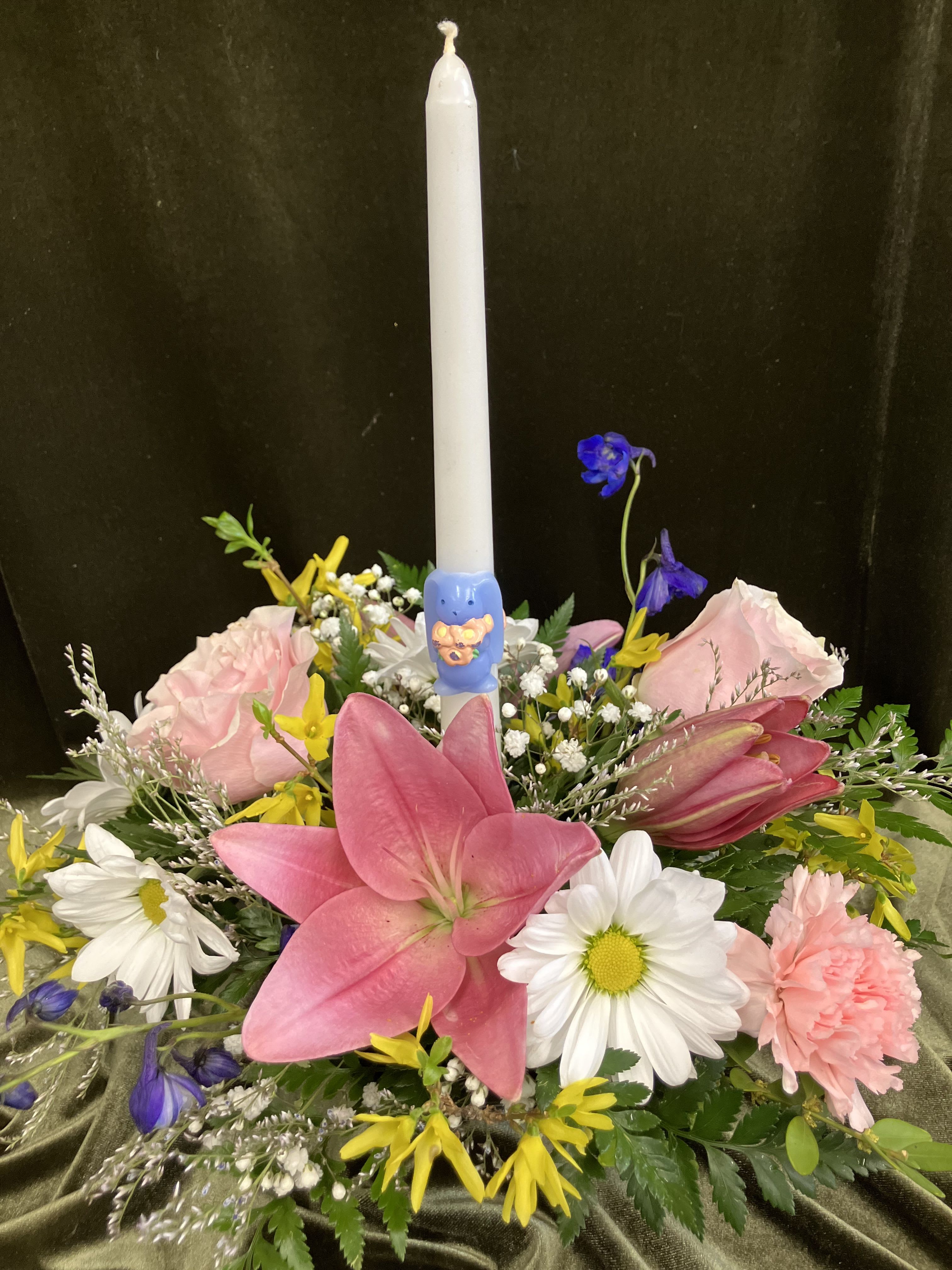 Bunny Candle Centerpiece  - Easter centerpiece featuring a bunny hugging the candle, fresh flowers include lily, roses, and bright seasonal forsythia! 